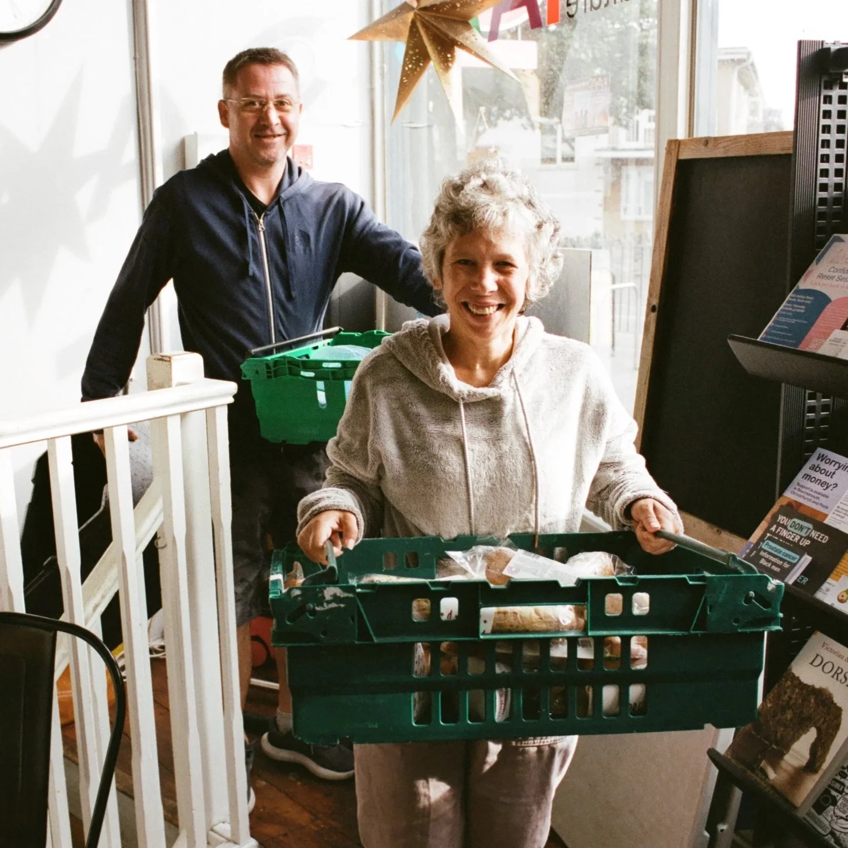 The welcoming storefront of the We Are Humans charity hub on Sea Road, captured during a busy community support drop-in day.