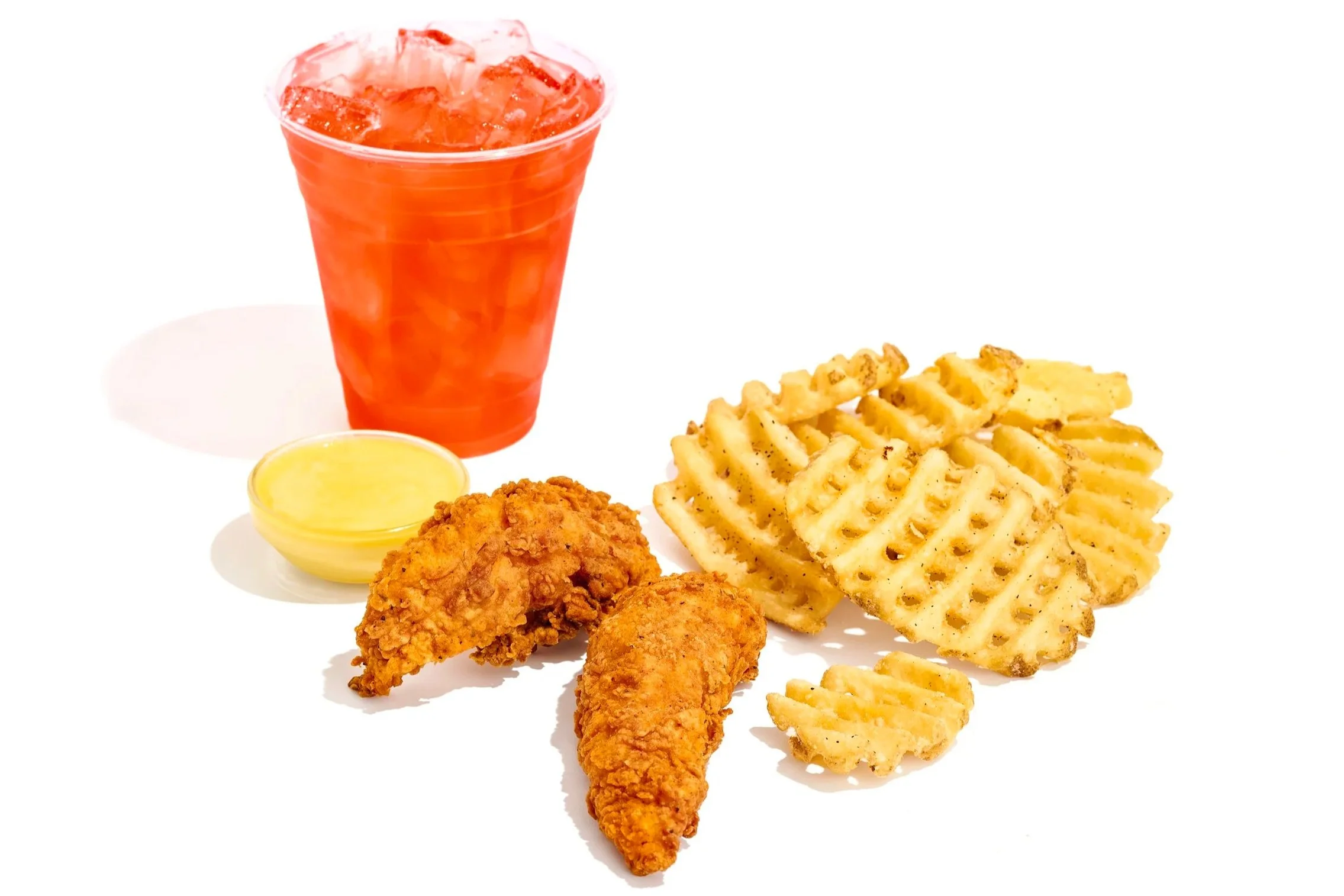 fried chicken tenders, waffle fries, fried chicken drumsticks, small cup of dipping sauce, and a soft drink with ice