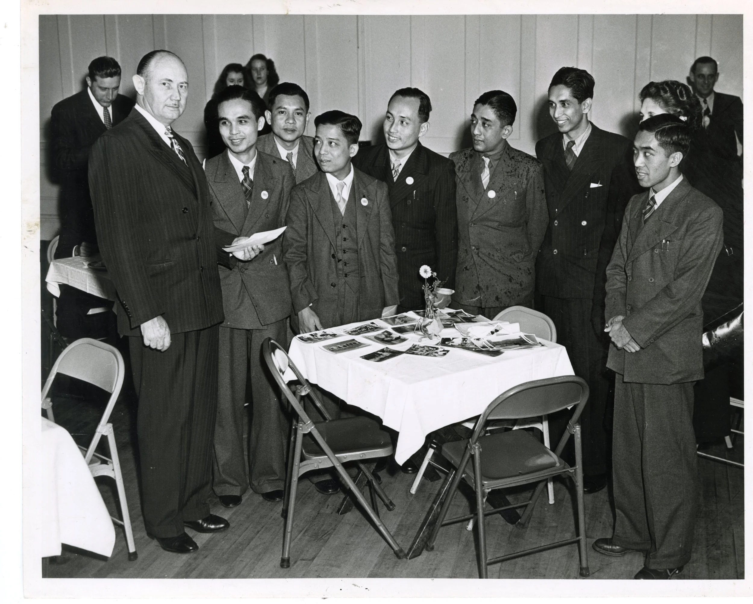 1930_GroupLookingAtPhotos_01.jpg