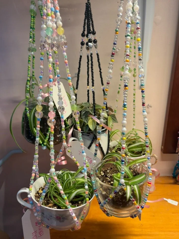 1: @rachel_crafts_ beaded plant hangers that come with a plant!! 
2: @lanebys polly pocket keychains with mystery outfits
3: @heyghosttmutt filler sticker sheets 🦷
4: @fantasticalforestart new originals and prints and stickers! 
5: @madisonshanonn s