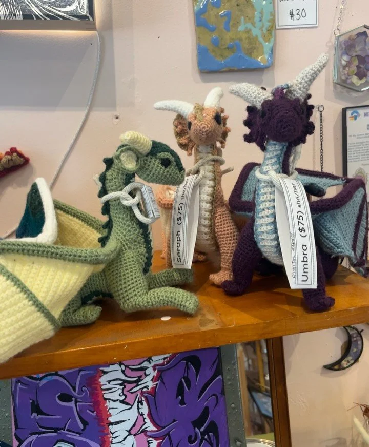 1: @digital_aspect Welcome!! New youth artist ! These dragons have their own stories and we are blown away by the talent!! 
2: @luxe.trauma bumper stickers restocked!!
3: @sew_human new one of a kind garments! 🍃🌗🃏
4: @sew.ayomi handmade tote bags 
