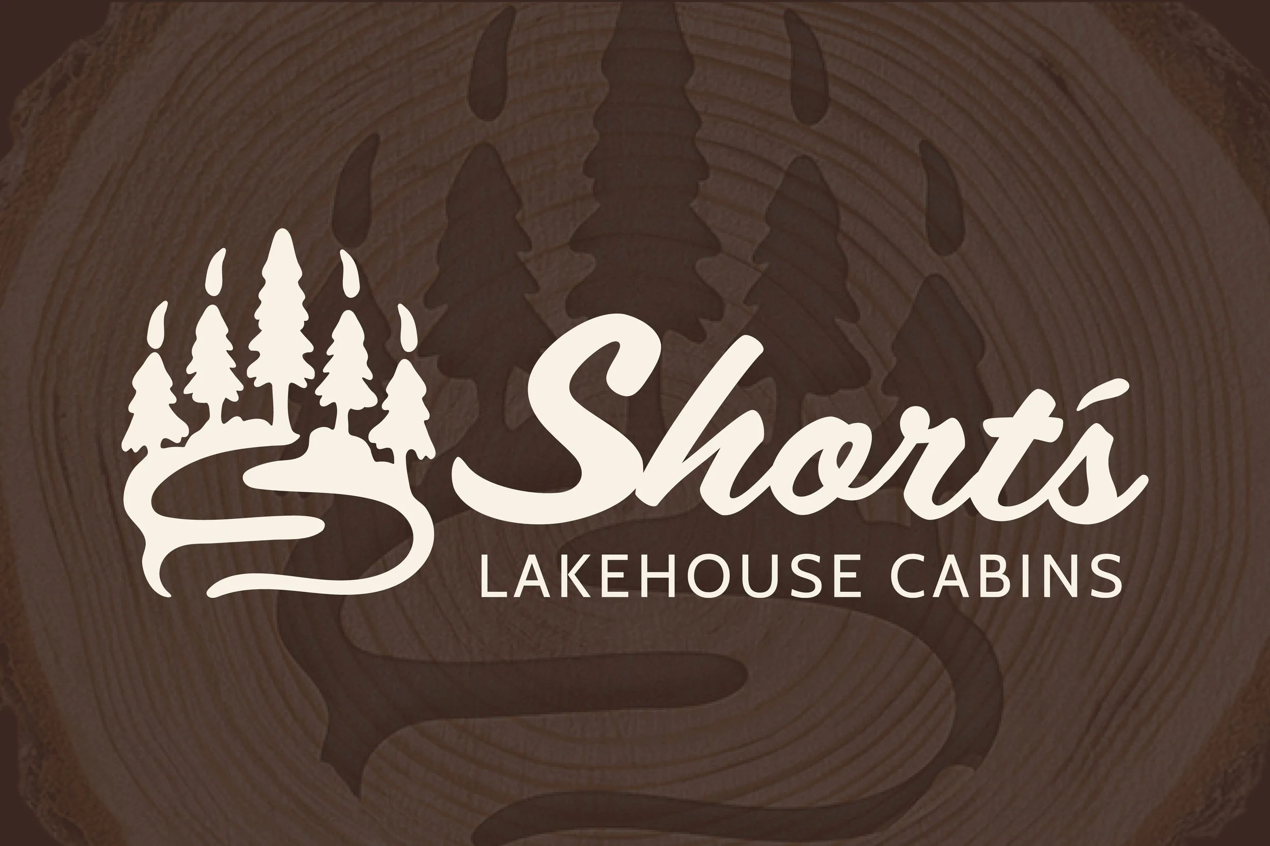 Logo for Share Lakehouse Cabins featuring stylized wood round in the background