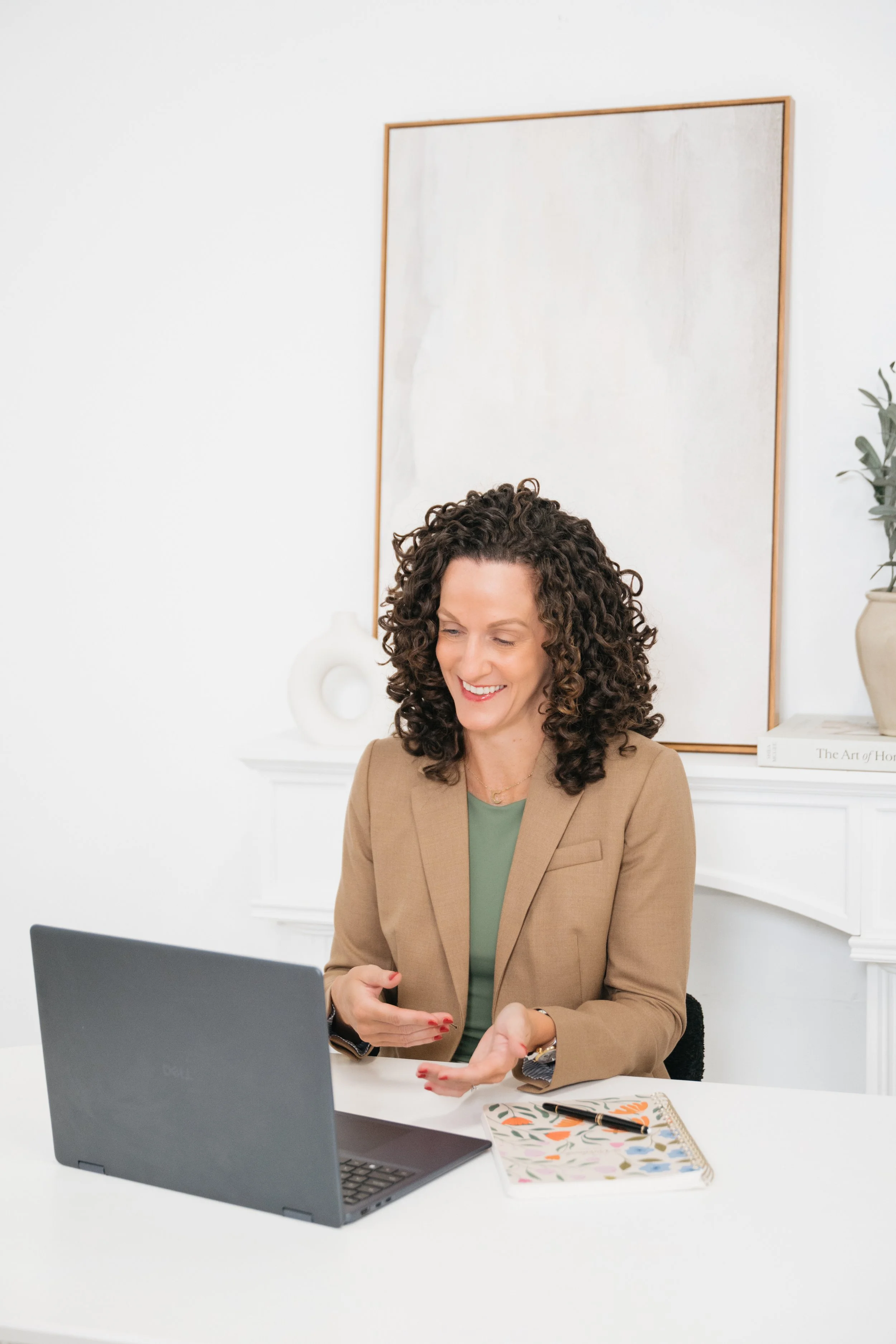 Courtney reviewing financial information at her desk