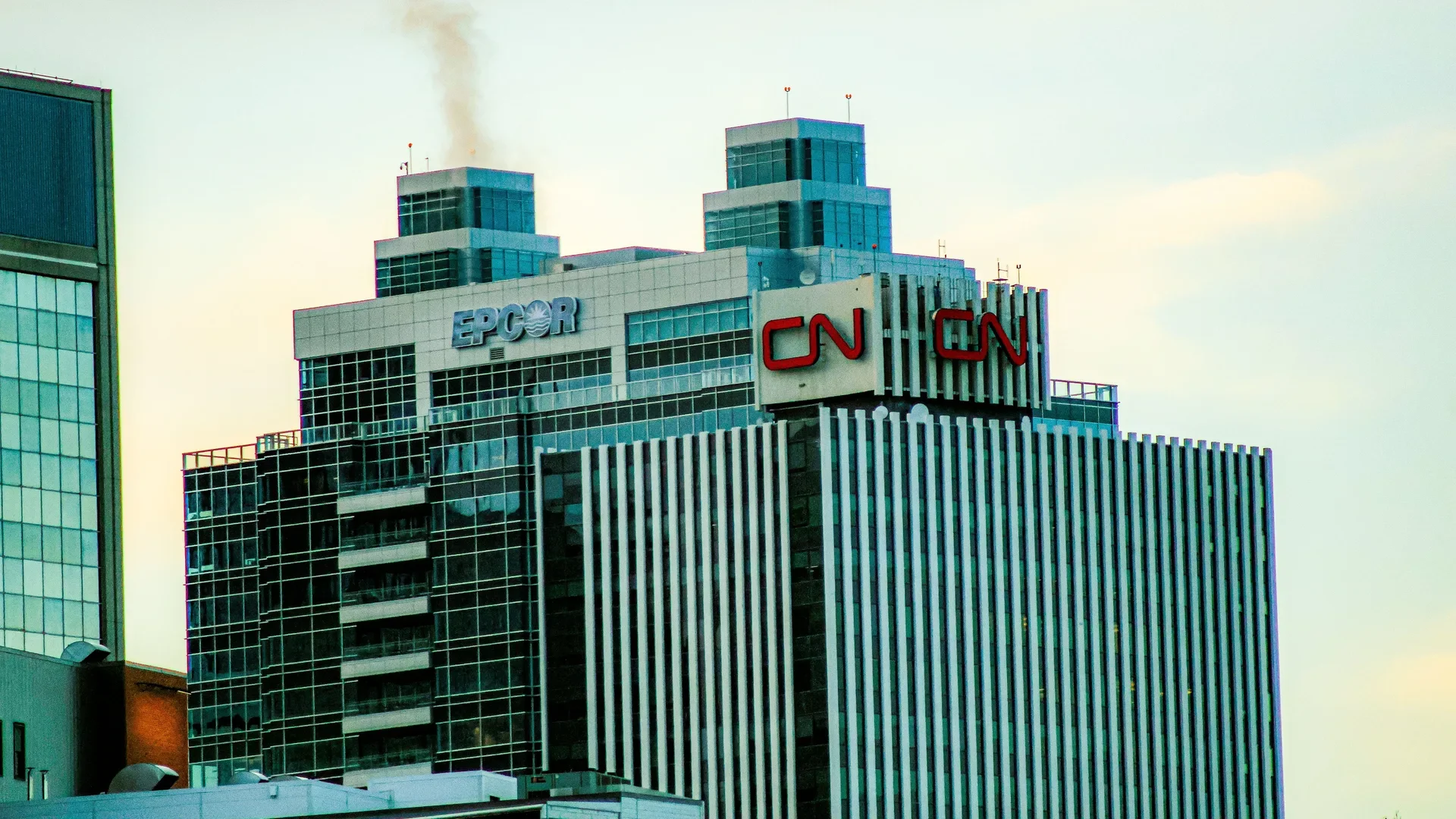 Close-up of the EPCOR and CN signage on top of an Edmonton office tower