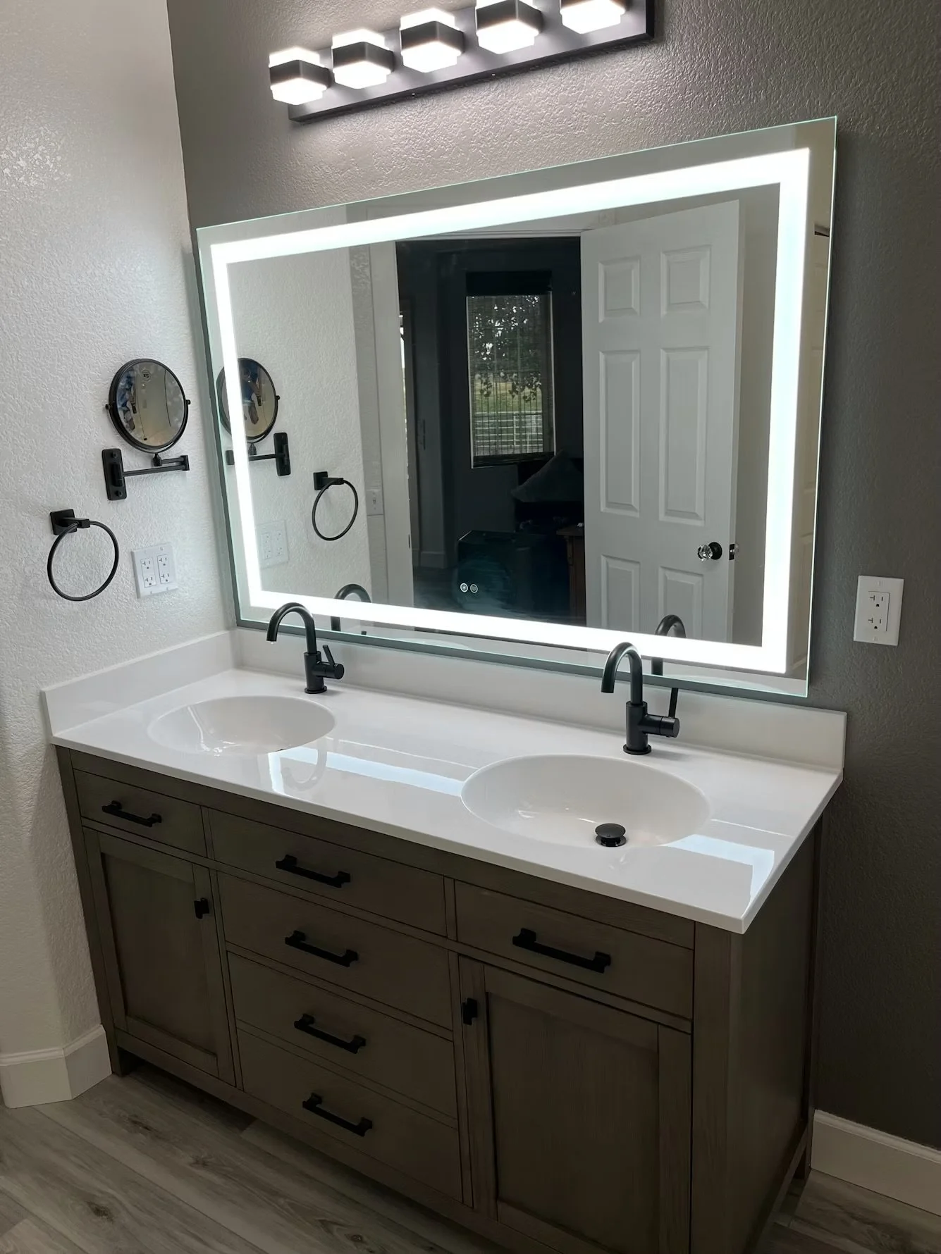 Double bathroom vanity with sinks and plumbing fixtures