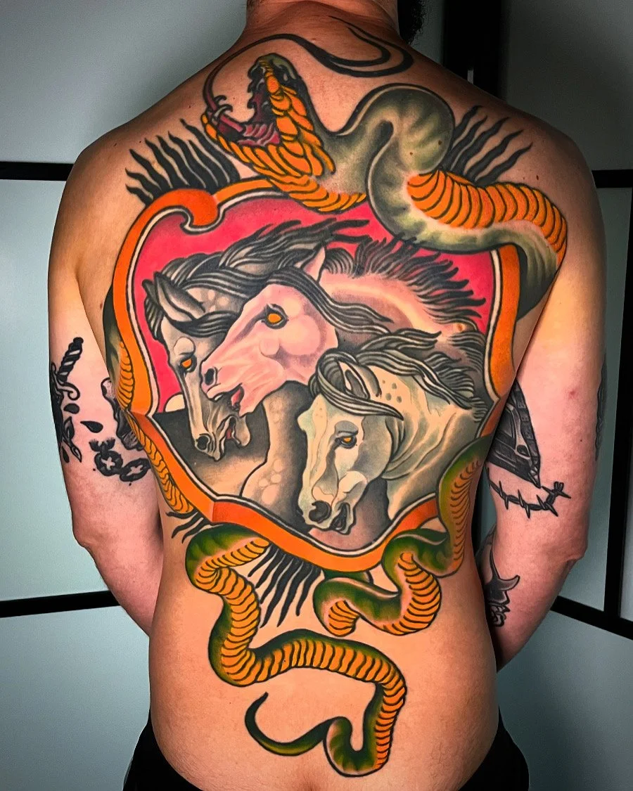 Large tattoo on a person's back featuring two horses in a stylized, colorful design surrounded by a snake and decorative elements. By Johnny Domus, Neo Traditional and Neo Japanese Tattoo.