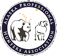 The logo of the Alaska Professional Hunters Association featuring a bear and a moose inside a circular design.