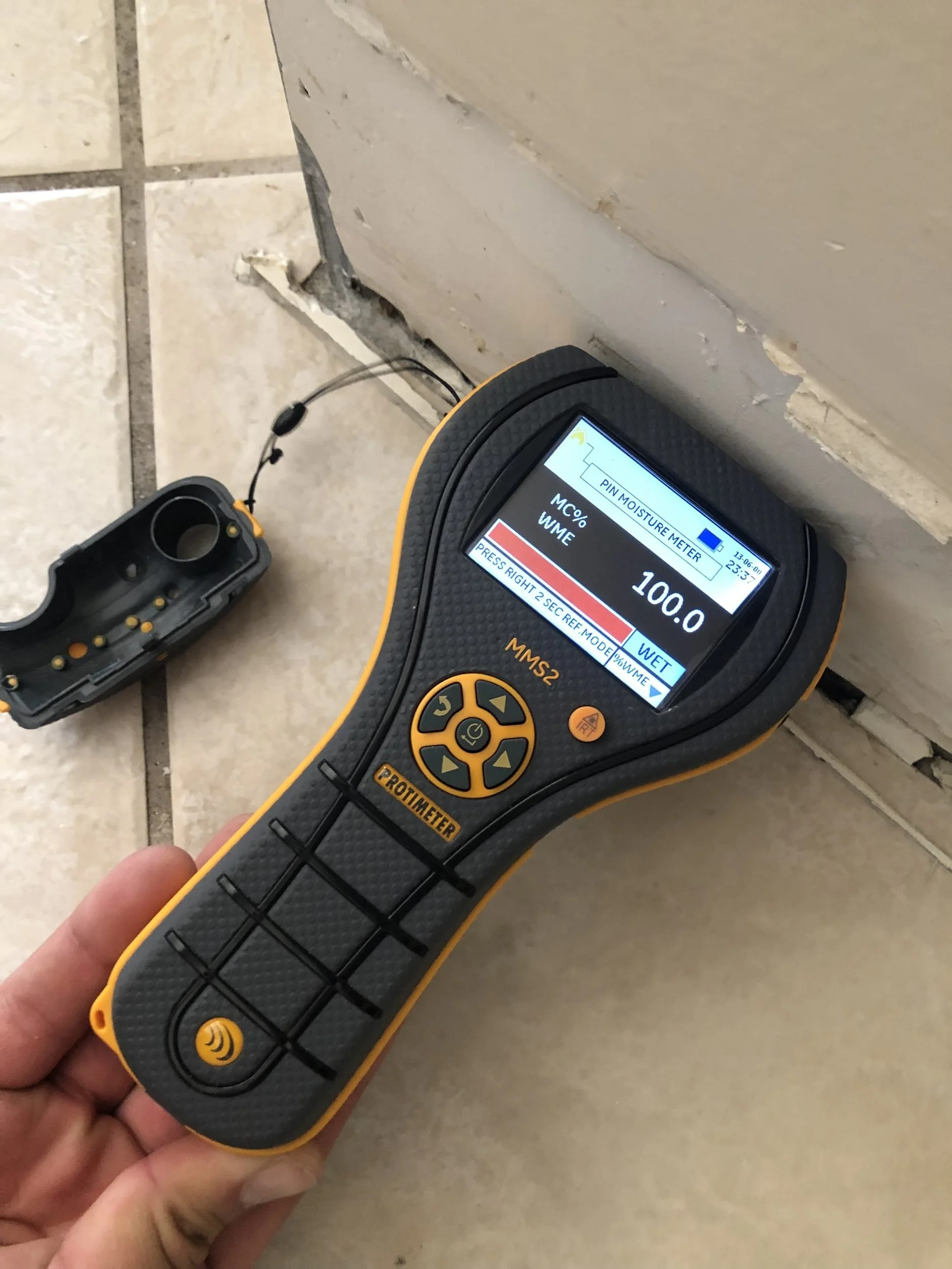 Moisture meter reading taken during water damage drying