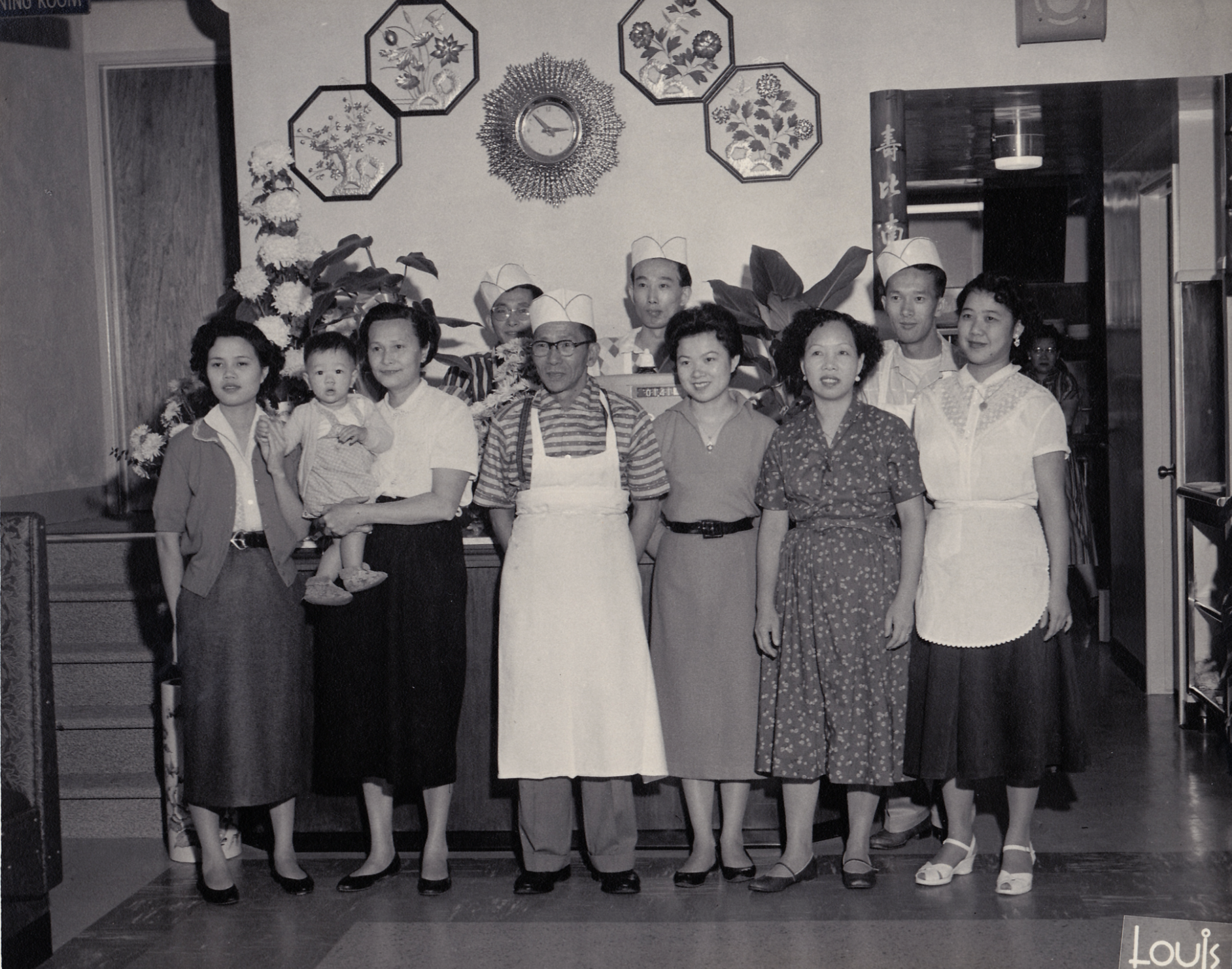 The Gin family taking a group photo in the mid-20th century