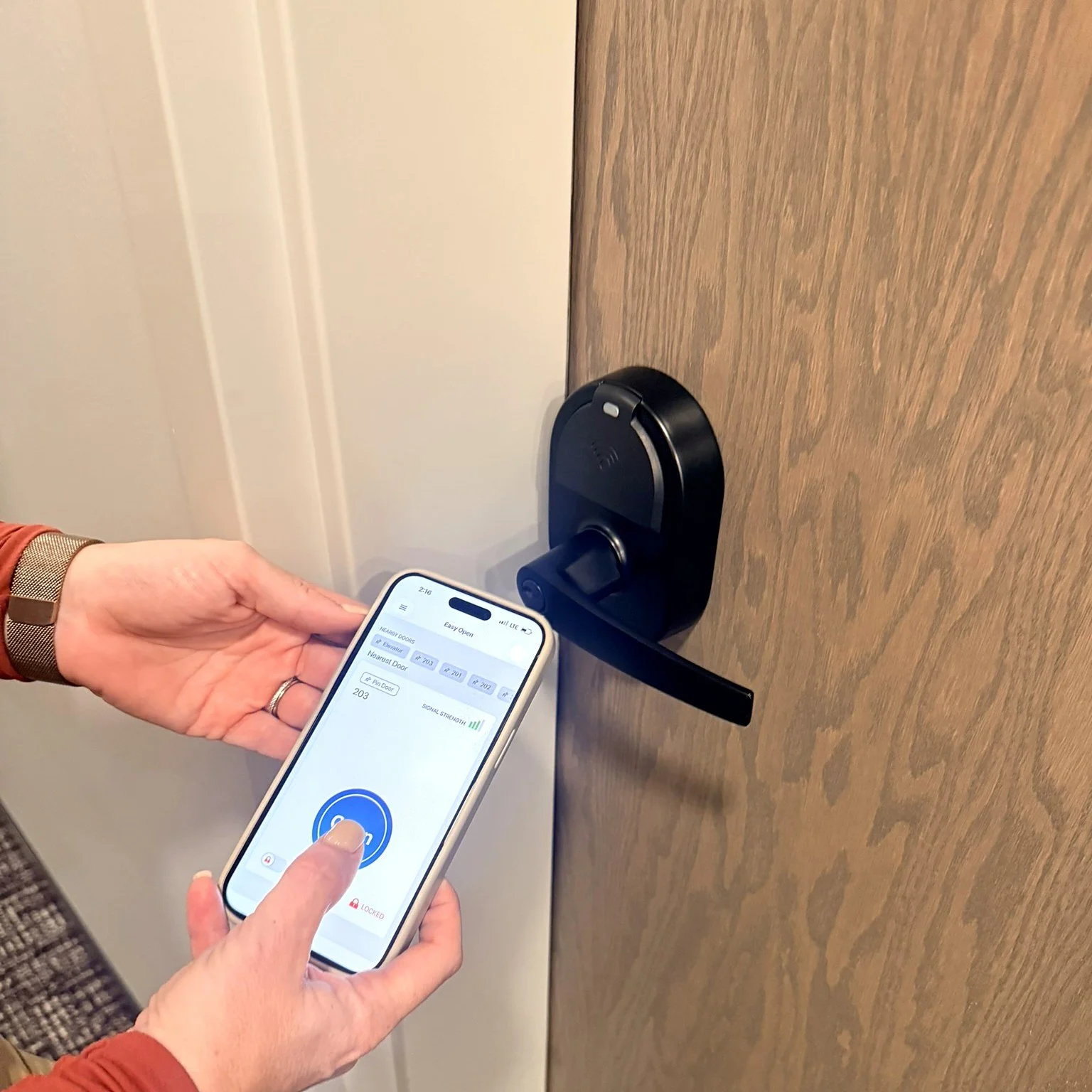 ZeroKey app unlocking an apartment door with a keyless lock.