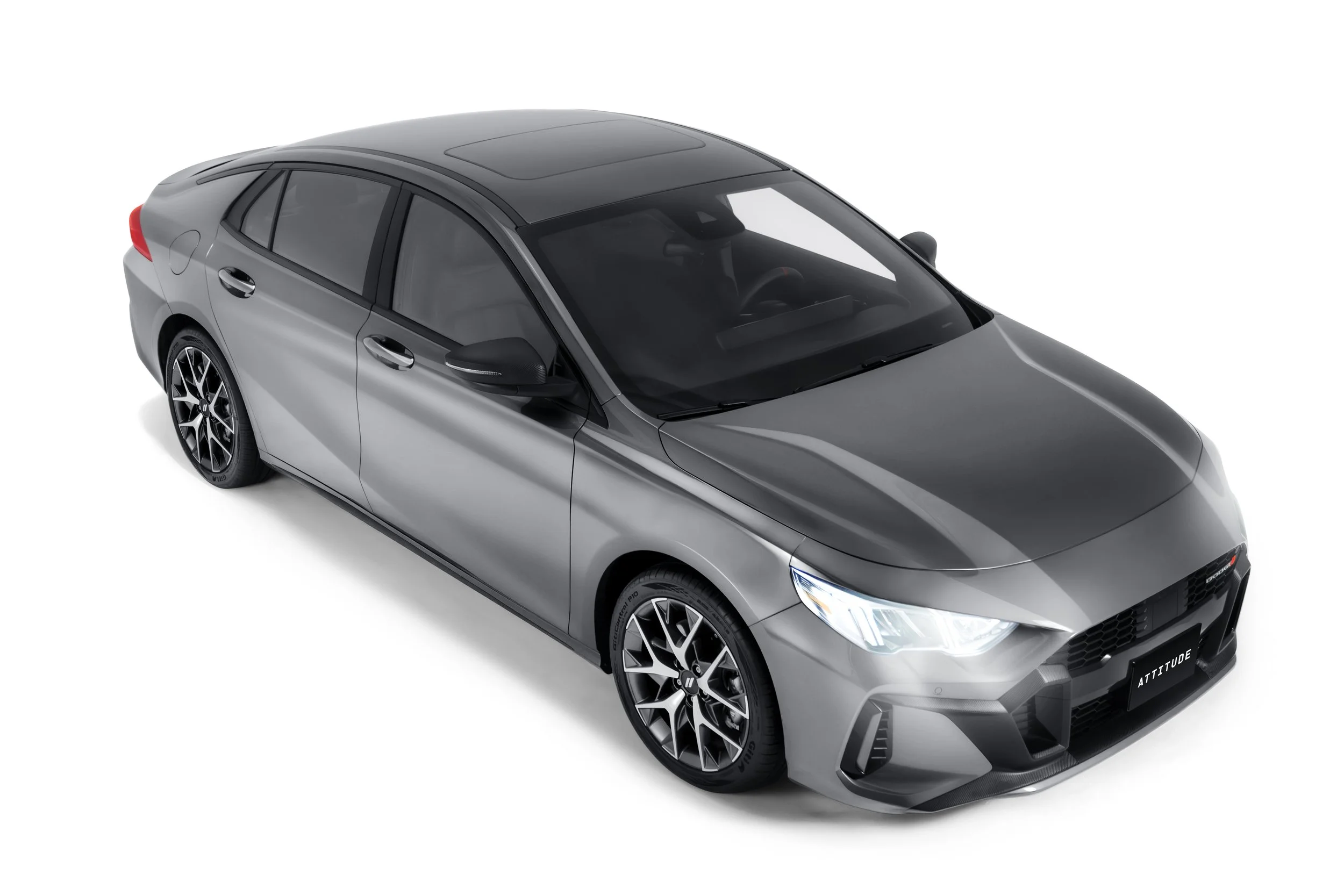 A sleek silver modern hatchback car viewed from the front and top angle, featuring black grille, sharp headlamps, and stylish alloy wheels.