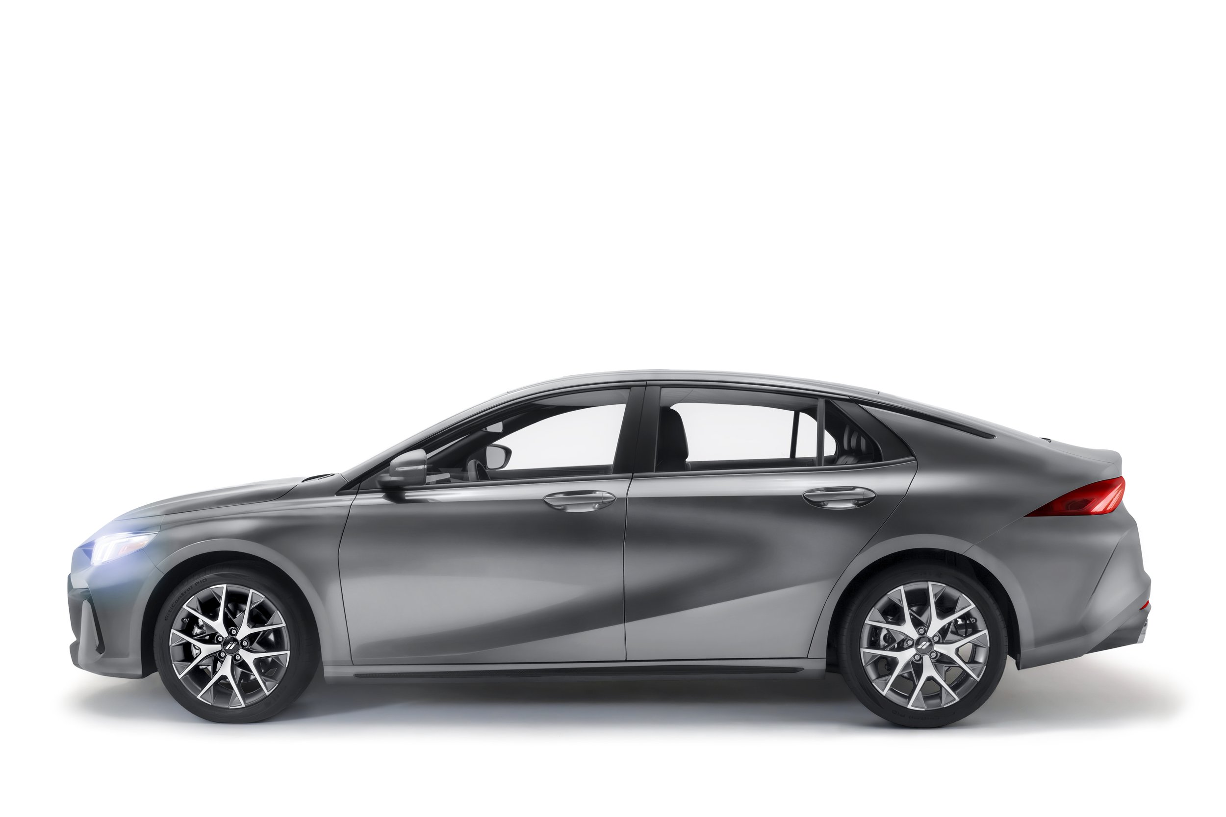 Side view of a silver modern sedan car with sleek design and stylish alloy wheels.