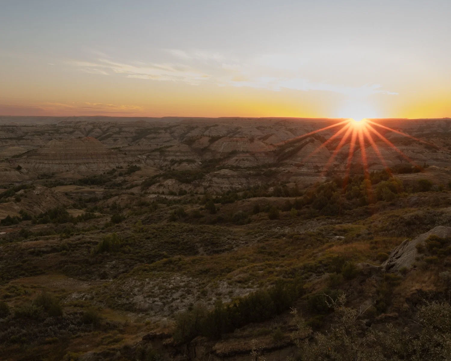 Sunrise over the rugged terrain.