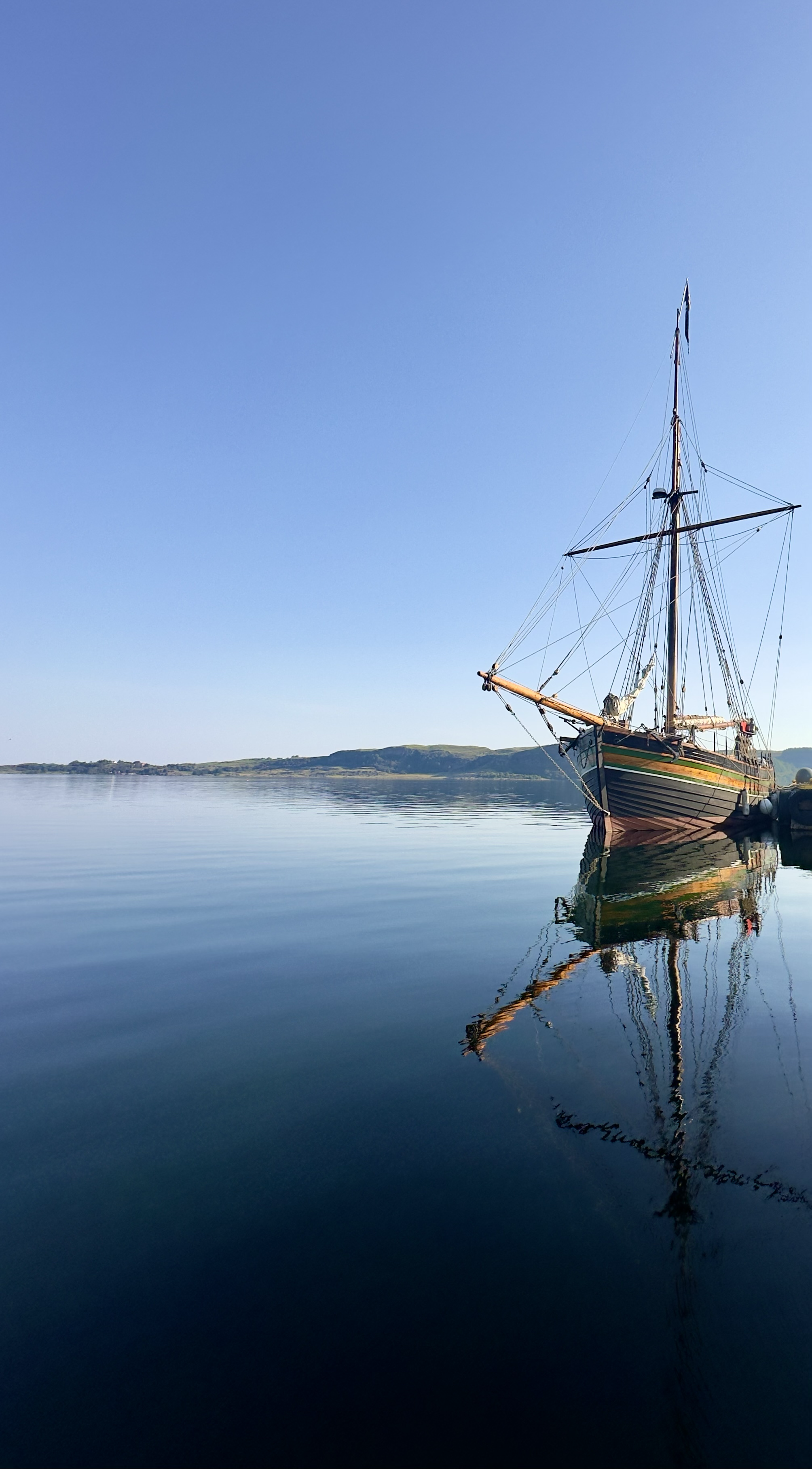Peaceful ship sailing on calm water, representing tranquility, mindfulness, and emotional balance through nature.