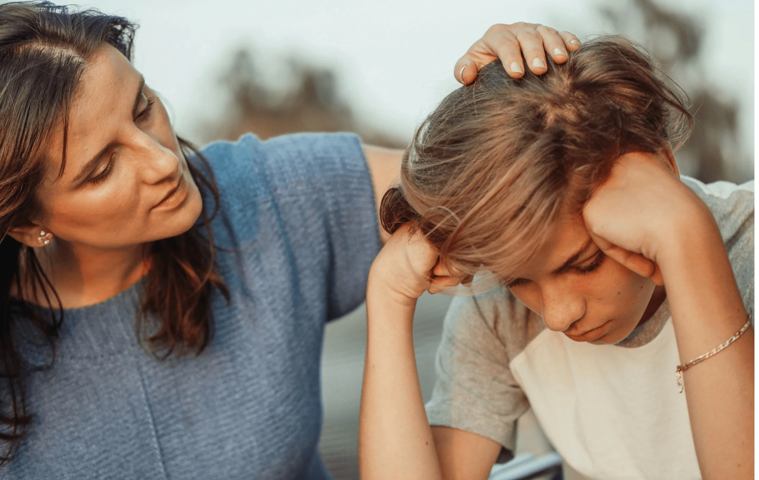 Parent offering emotional support to a teenager, discussing ways to manage anxiety, school stress, and social pressure in a calm environment