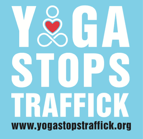 Poster with the words 'Yoga Stops Traffic' and a website URL 'www.yogastopstraffick.org'.