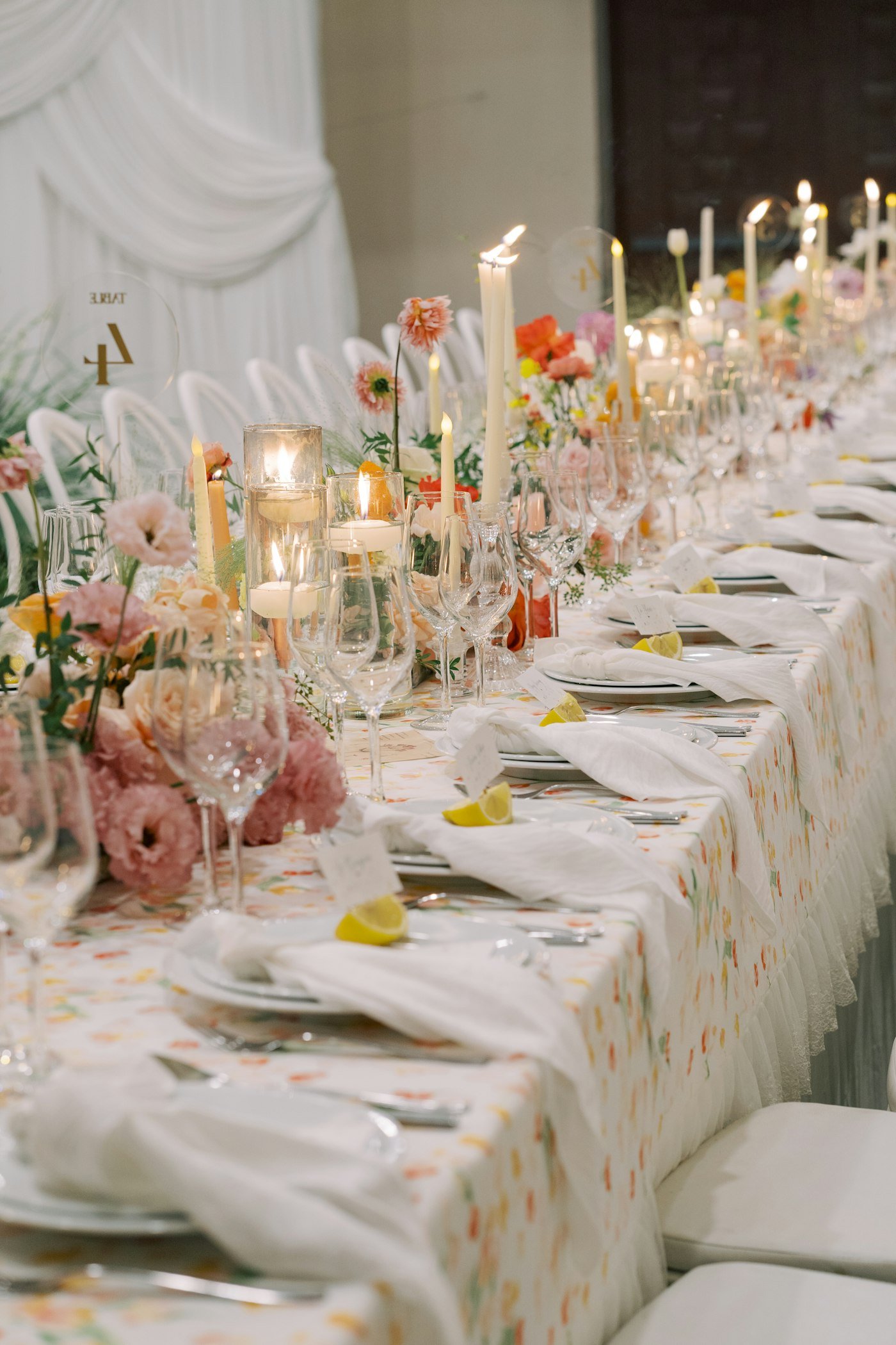 Long celebration table with flowers and candles