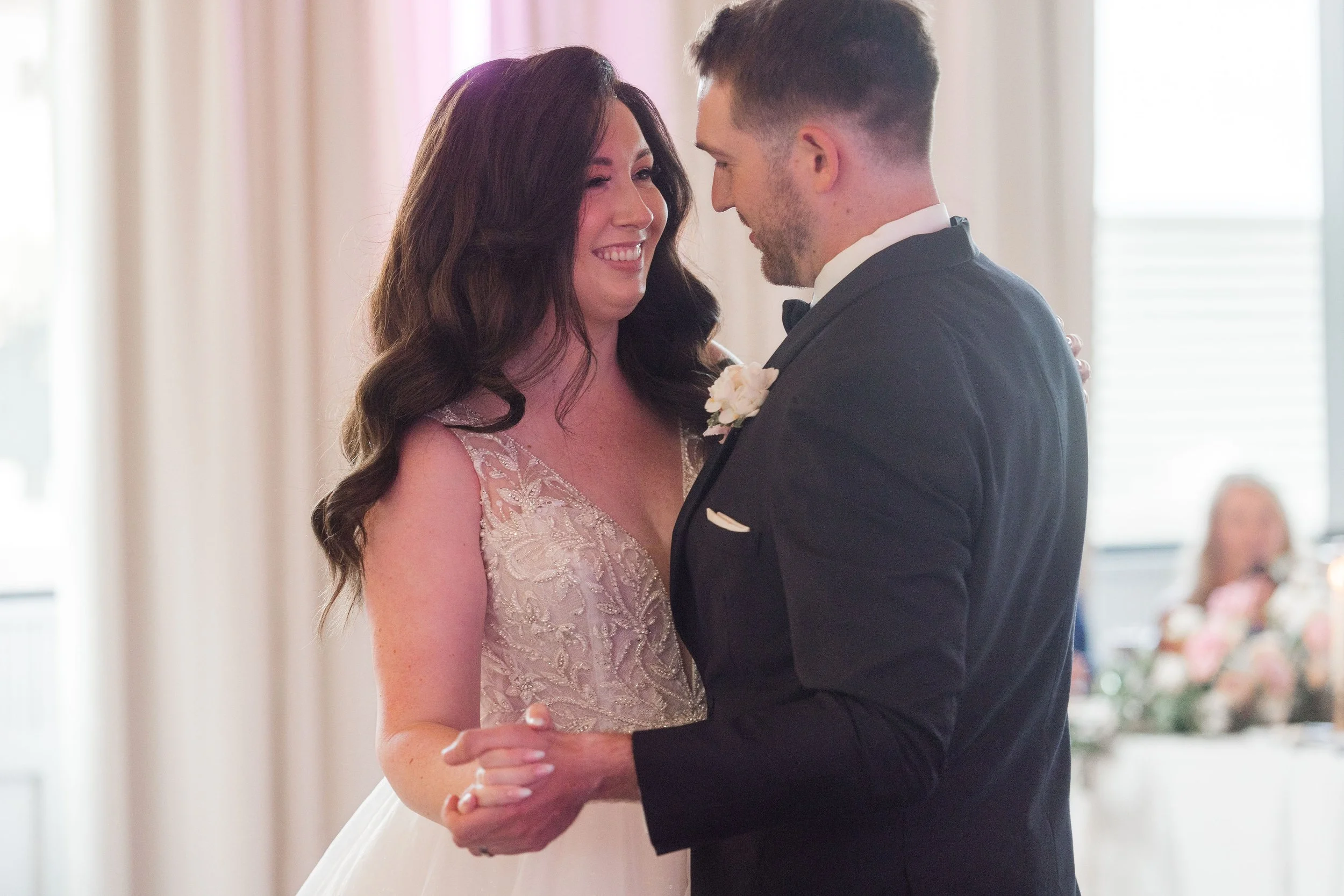 Bride and groom sharing their first dance during a luxury wedding reception
