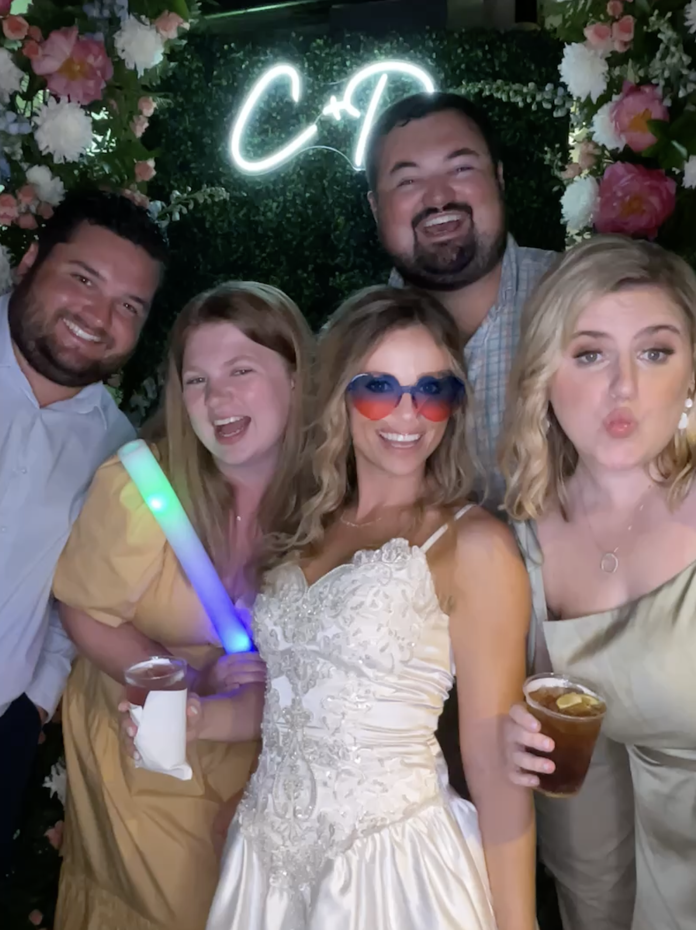 Guests enjoying a photo booth experience at a Savannah Georgia wedding reception