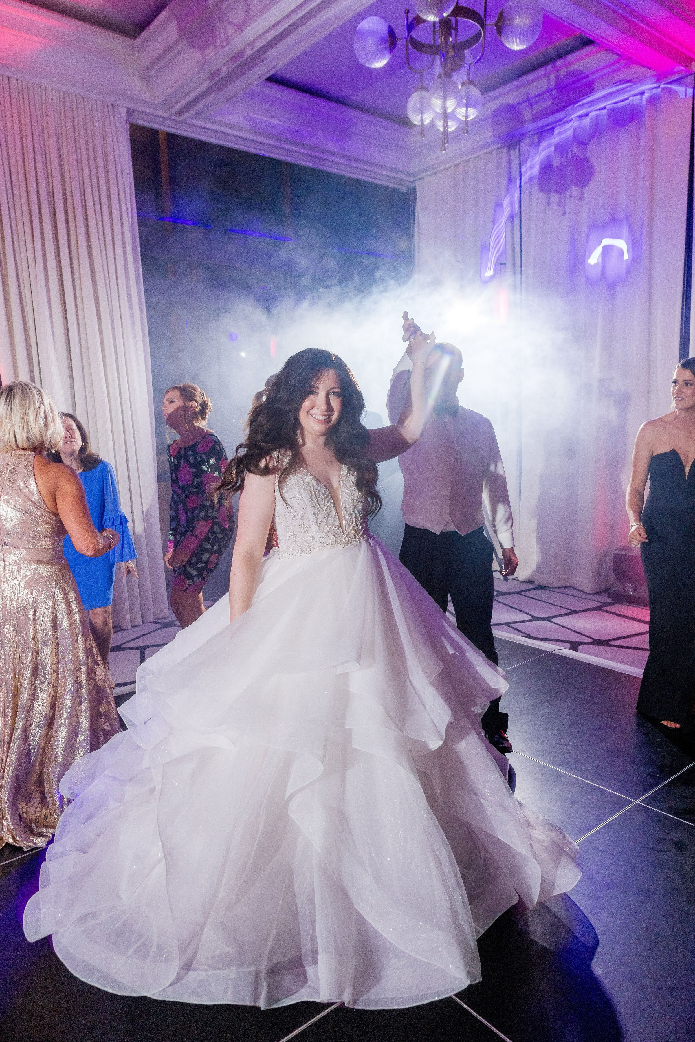 Bride celebrating with guests on a packed wedding dance floor in Savannah Georgia
