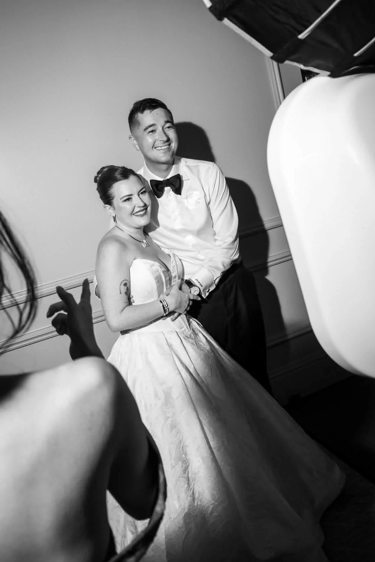 Wedding guests enjoying an interactive photo booth experience during the reception