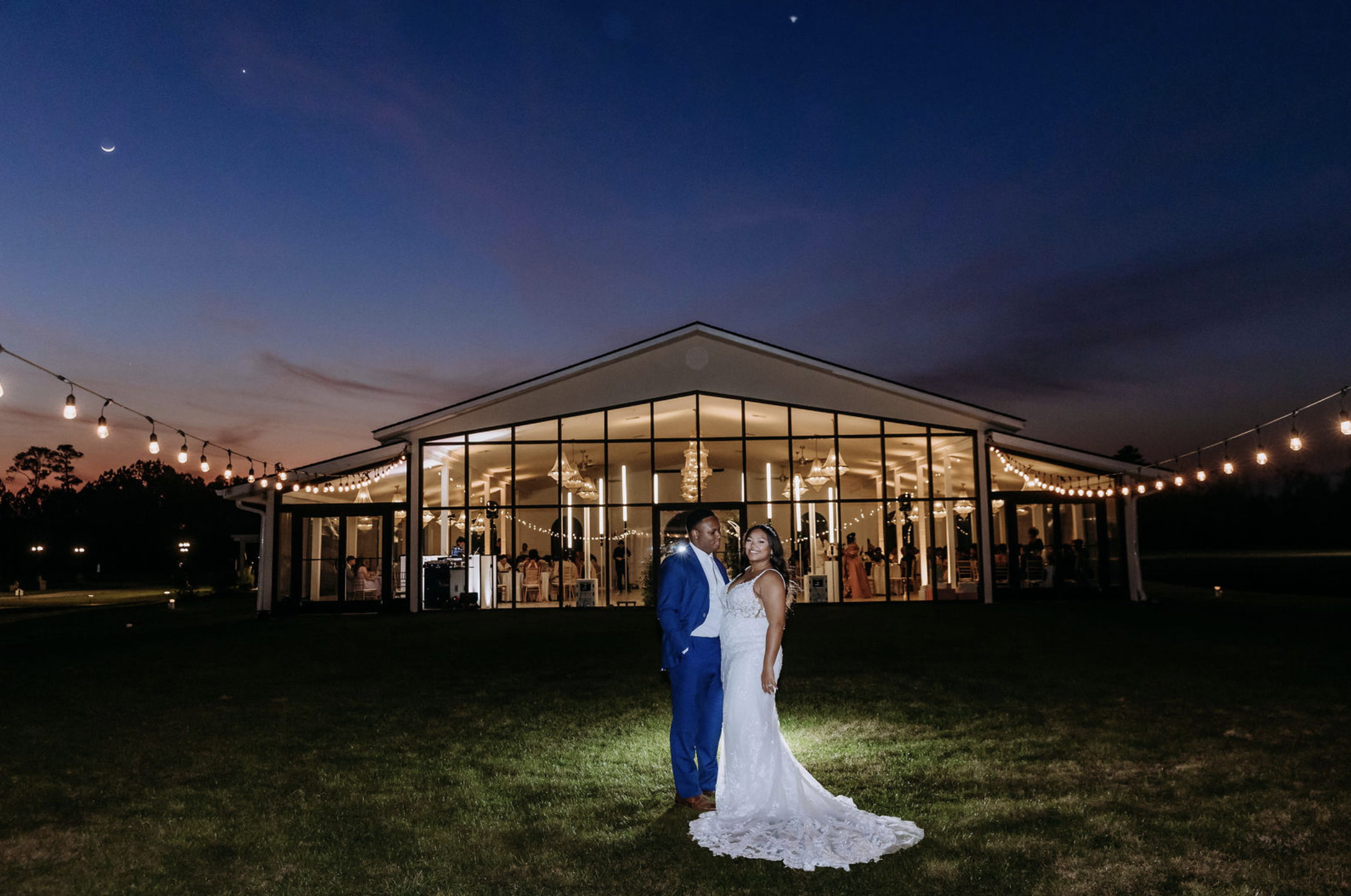 Bride and groom outside a luxury Savannah wedding venue at sunset