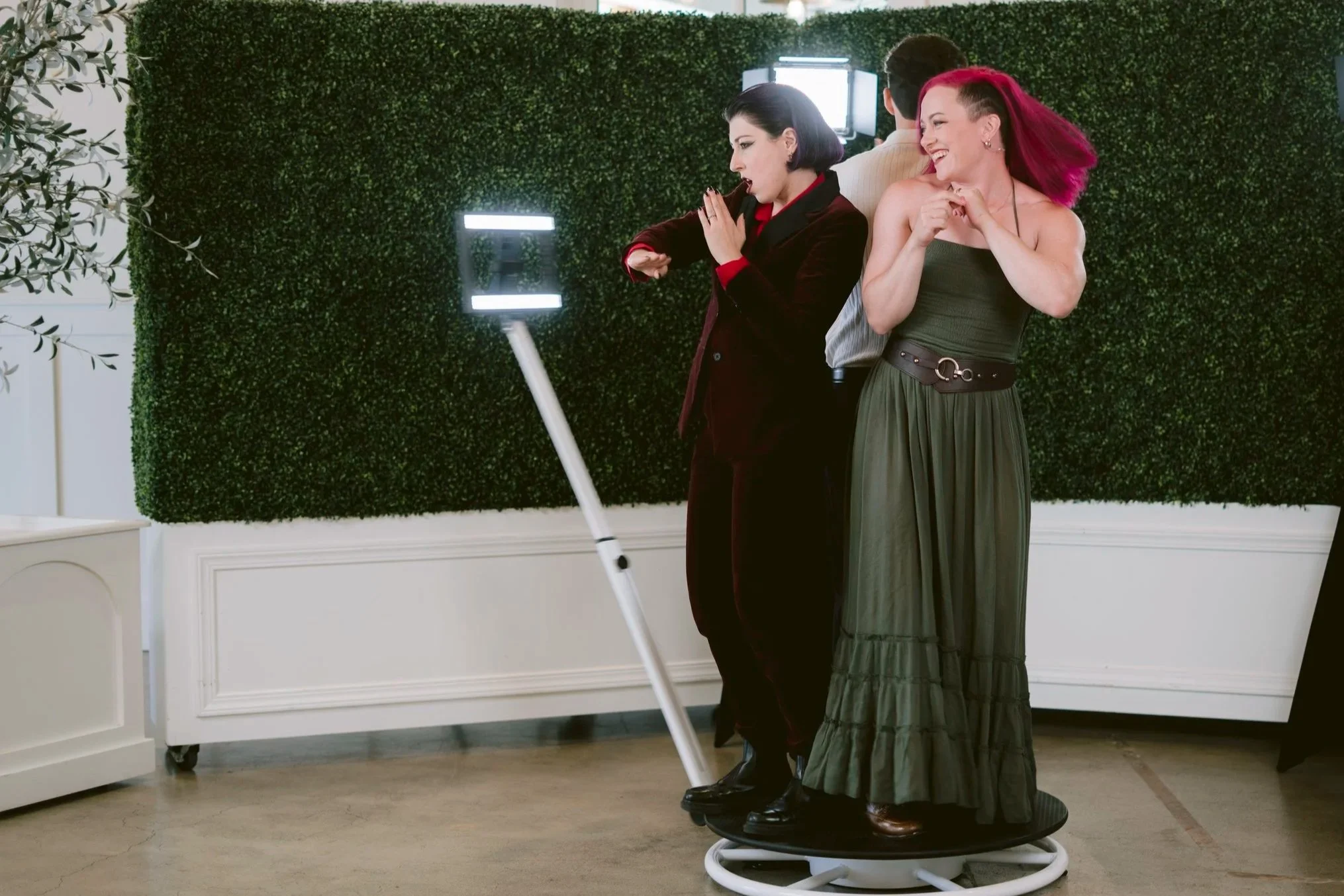 Guests enjoying the 360 video booth experience at a Savannah Georgia wedding reception