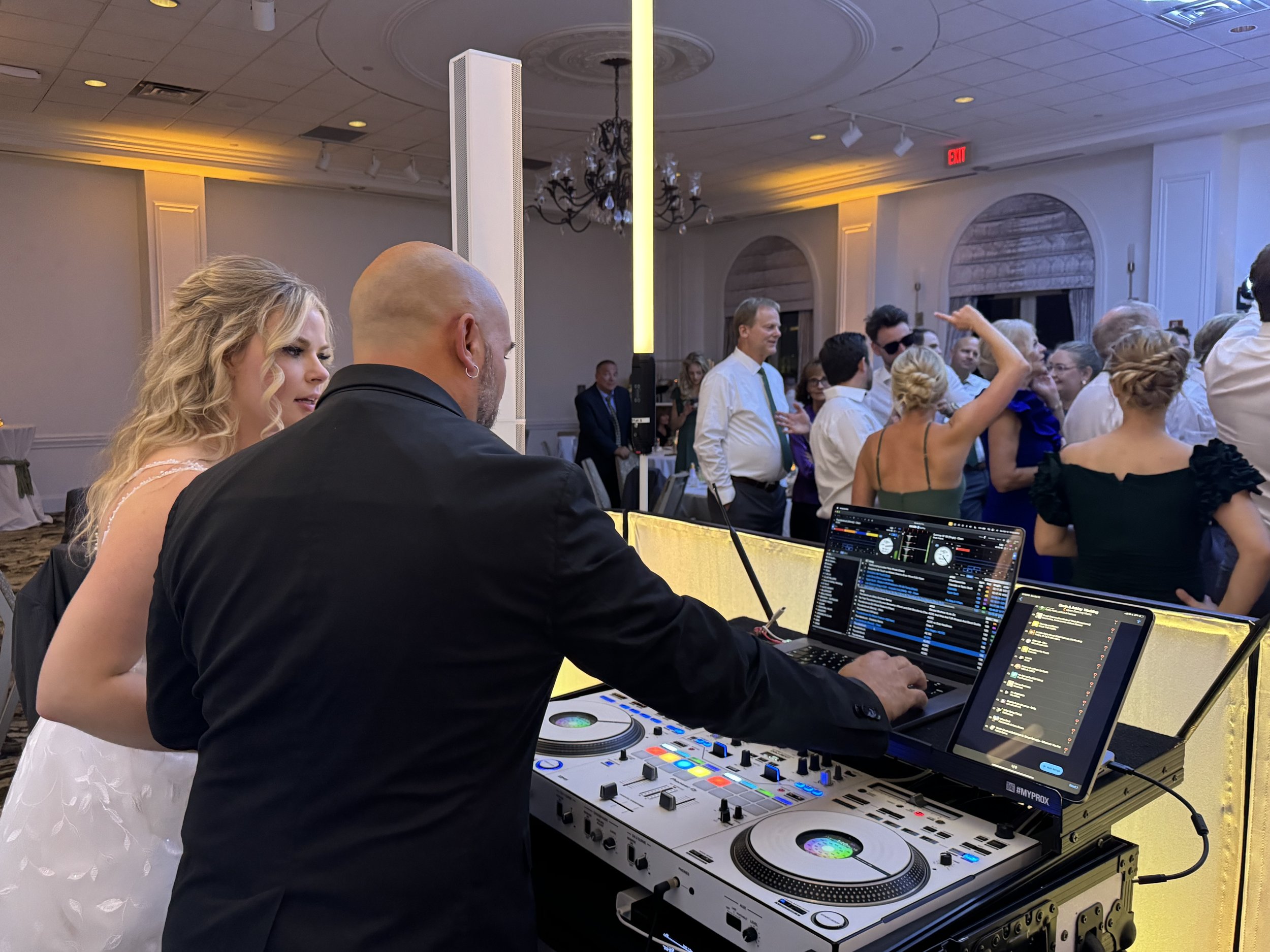 DJ César meeting with a bride and groom during their wedding reception in Savannah Georgia