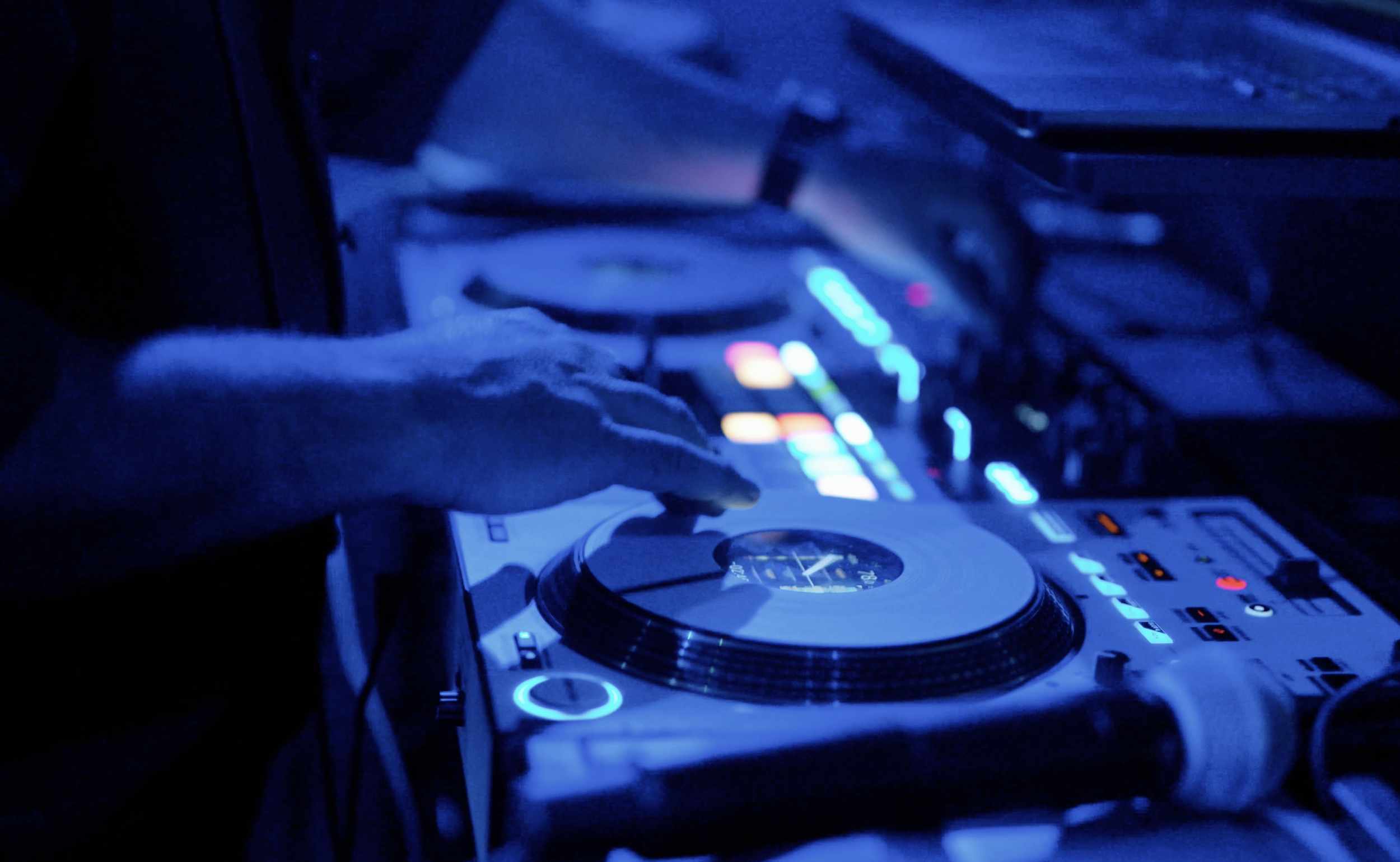 Professional wedding DJ mixing music live during a Savannah Georgia reception