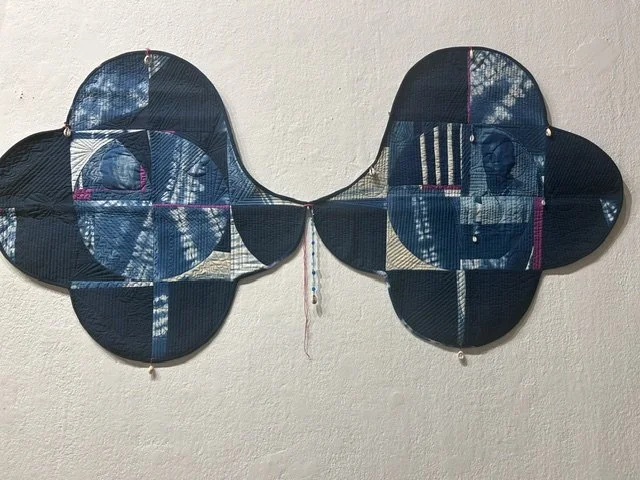 Touched by blue, shaped by space,
Dyed Indigo, cotton, thread, glass beads, cowrie shells
28 x 56
2025