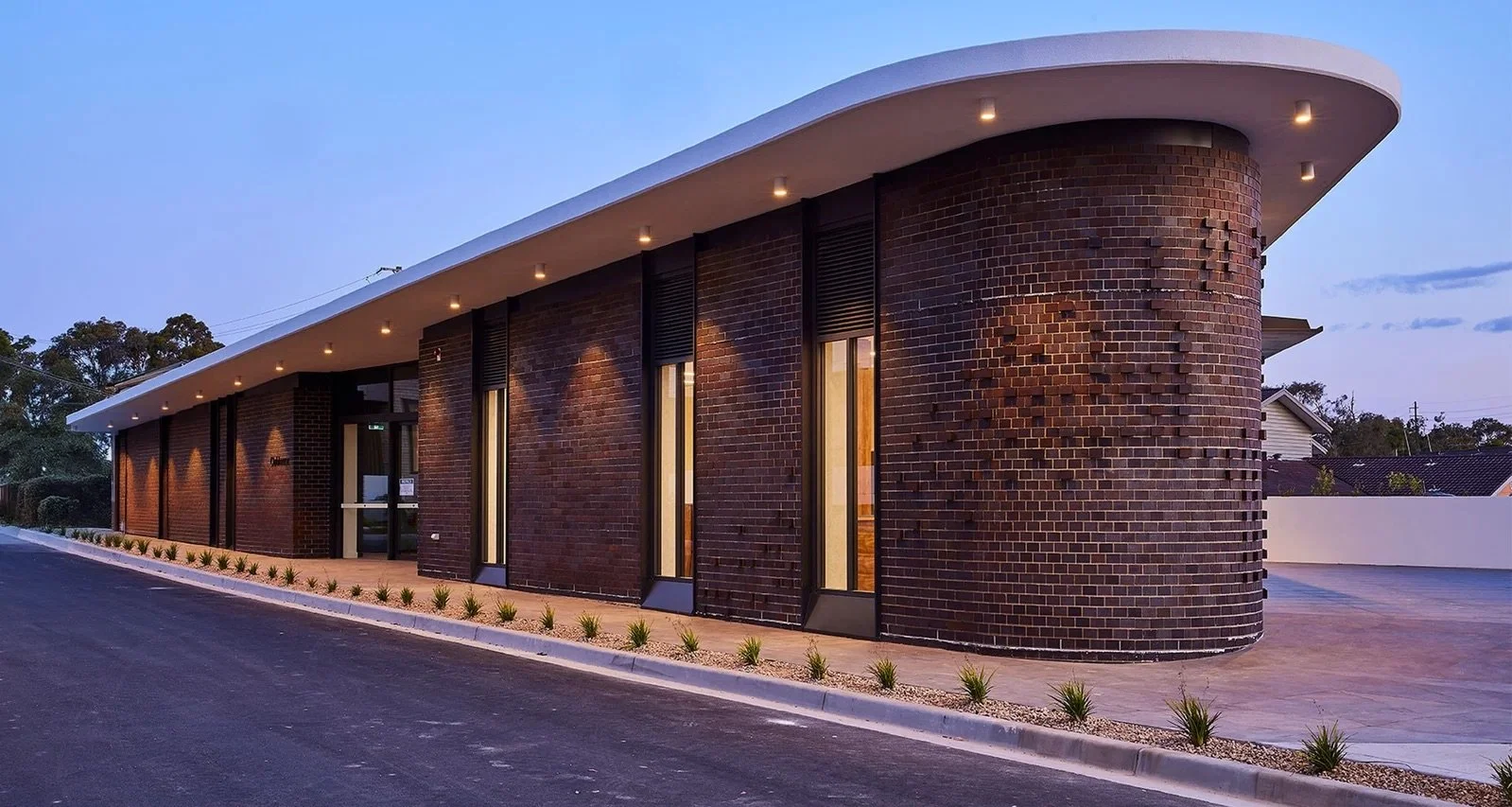 005-vertical-image-clubhouse-exterior-at-night-bellburra-richard-crookes-constructions-retirement-living.jpeg