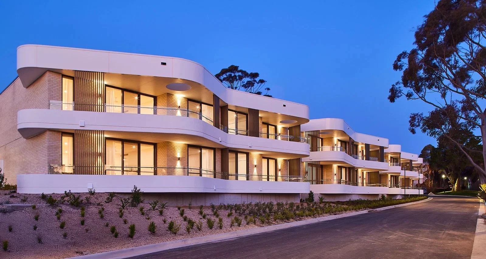 006-alternate-street-view-of-apartments-and-landscaping-dusk-bellburra-richard-crookes-constructions-retirement-living.jpeg