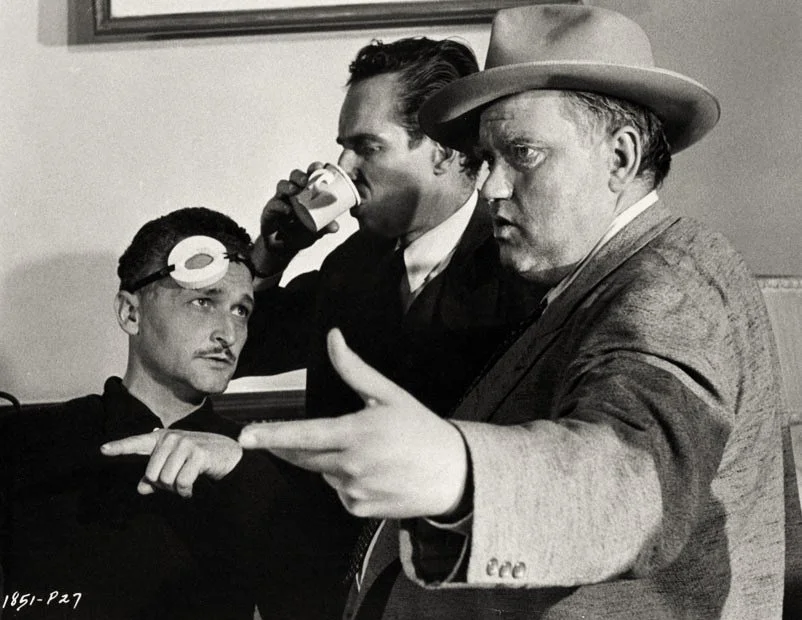 Orson Welles, Charlton Heston and camera operator Philip H. Lathrop on the set of Touch of Evil in 1957