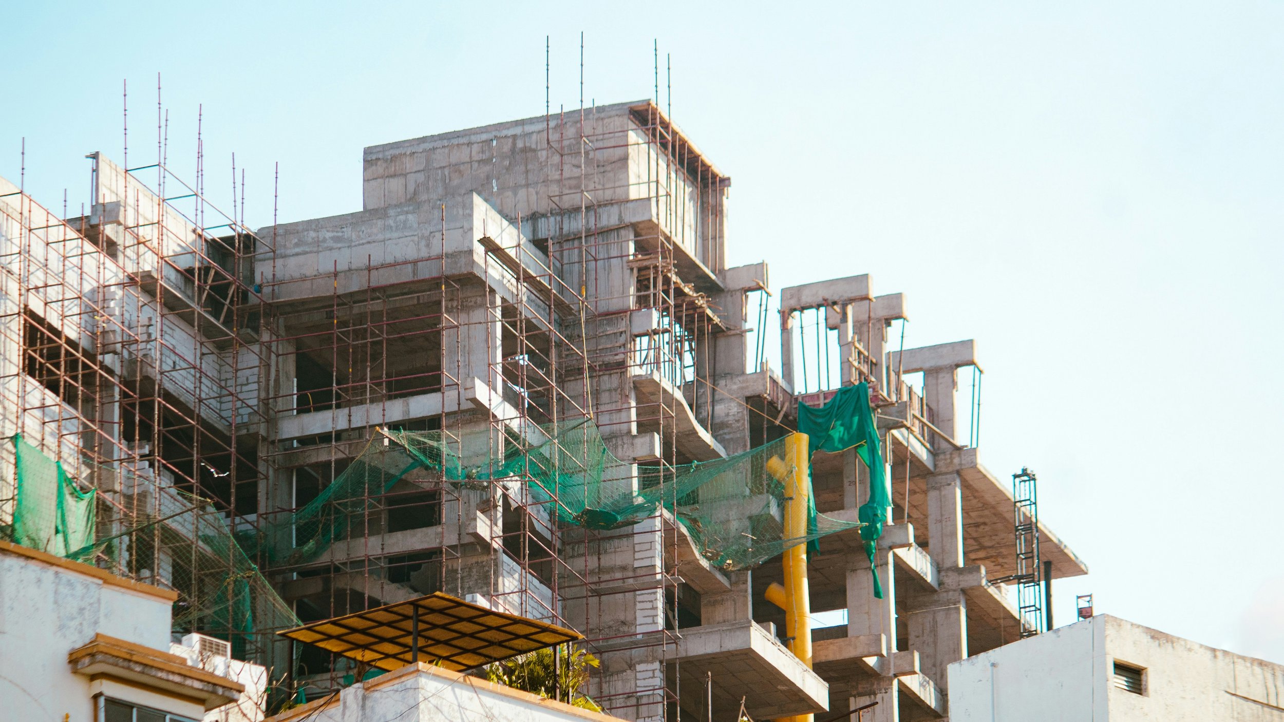 Multi-story residential construction with scaffolding — municipal approval and permitting services Boston Cambridge SomervilleMulti-story residential construction with scaffolding — municipal approval and permitting services Boston Cambridge Somervil