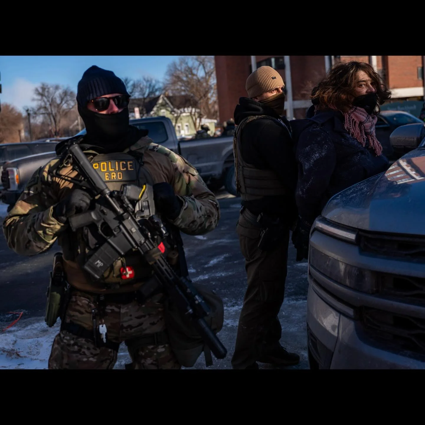 A federal agent detains a person near the site where a man identified as Alex Pretti was fatally shot by federal agents who were trying to detain him, in Minneapolis, Minnesota, U.S., January 24, 2026. ( Photo by @seth_herald for @reuters ) #minneapo