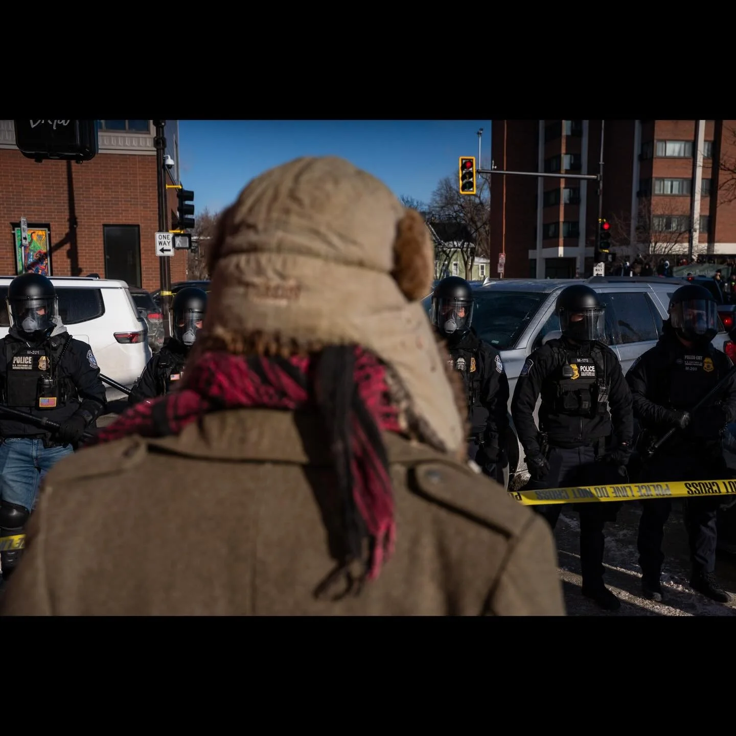 Community members gather and protest near the site where a man identified as Alex Pretti was fatally shot by federal agents who were trying to detain him, in Minneapolis, Minnesota, U.S., January 24, 2026. ( photos by @seth_herald for @reuters ) #min