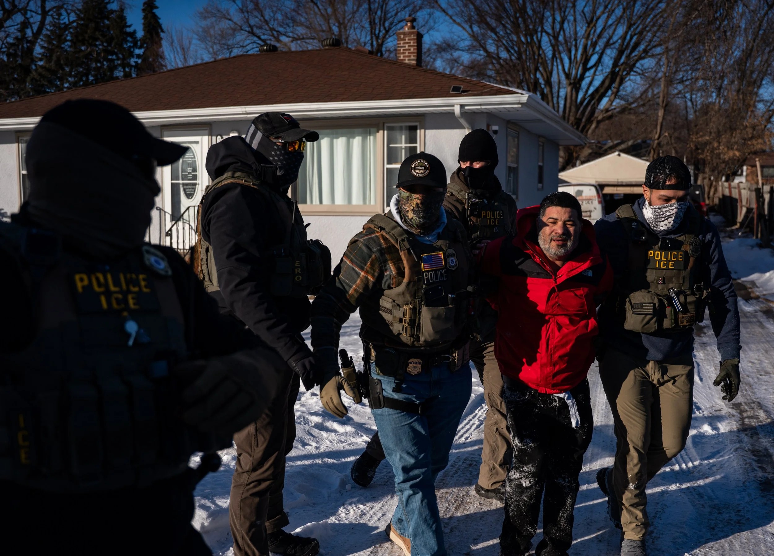  Federal agents detain a man as they conduct immigration enforcement action in Saint Paul, Minnesota, U.S., January 27, 2026. REUTERS/Seth Herald 