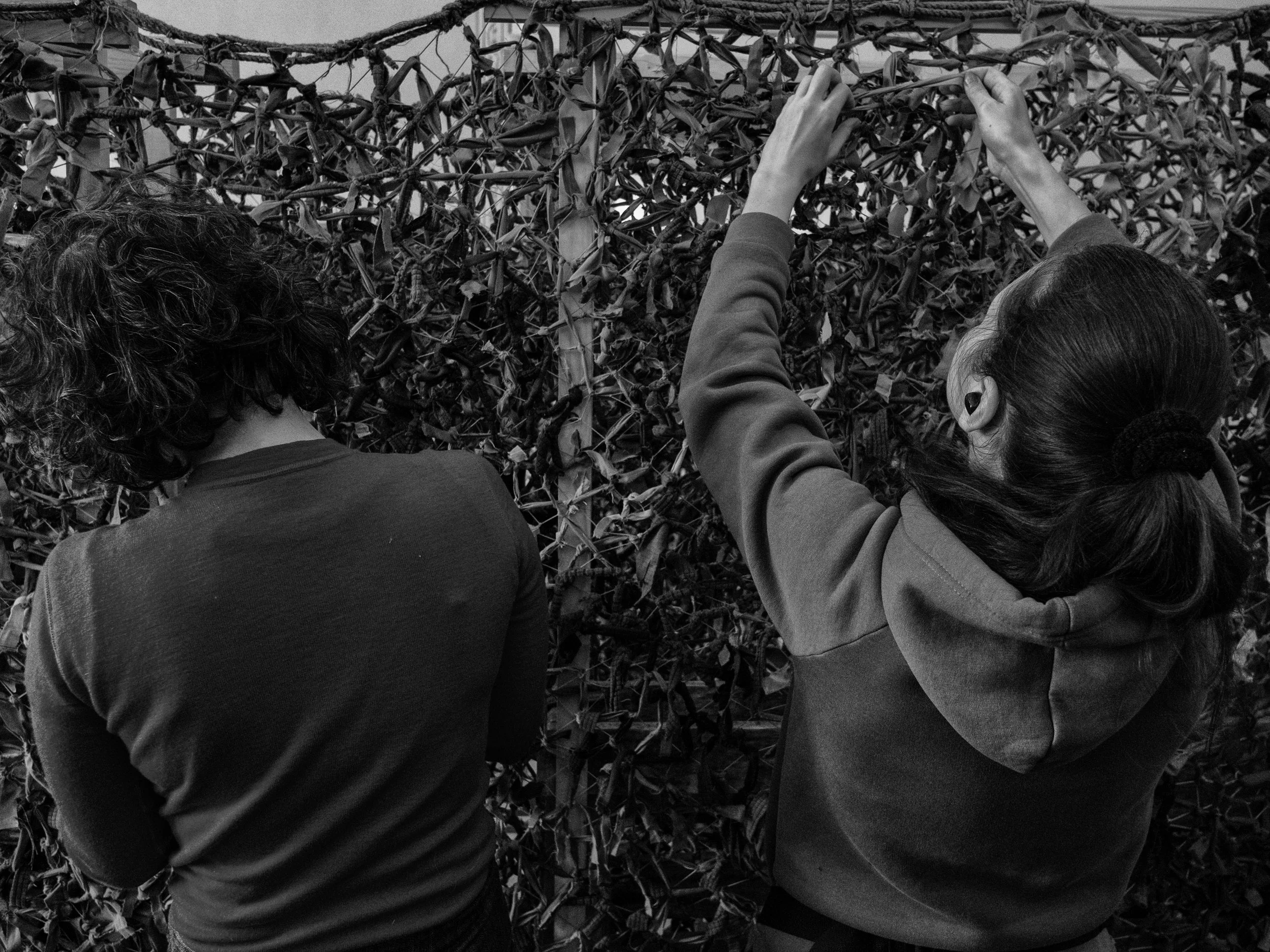  Volunteers in Lviv, Ukraine assemble camouflage netting.    SETH HERALD REDUX PICTURES FOR HUFFPOST  