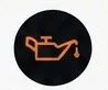 Car engine warning light on a black background.