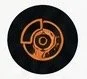 A digital or graphic representation of a circular, orange-colored target symbol with concentric rings on a black background.