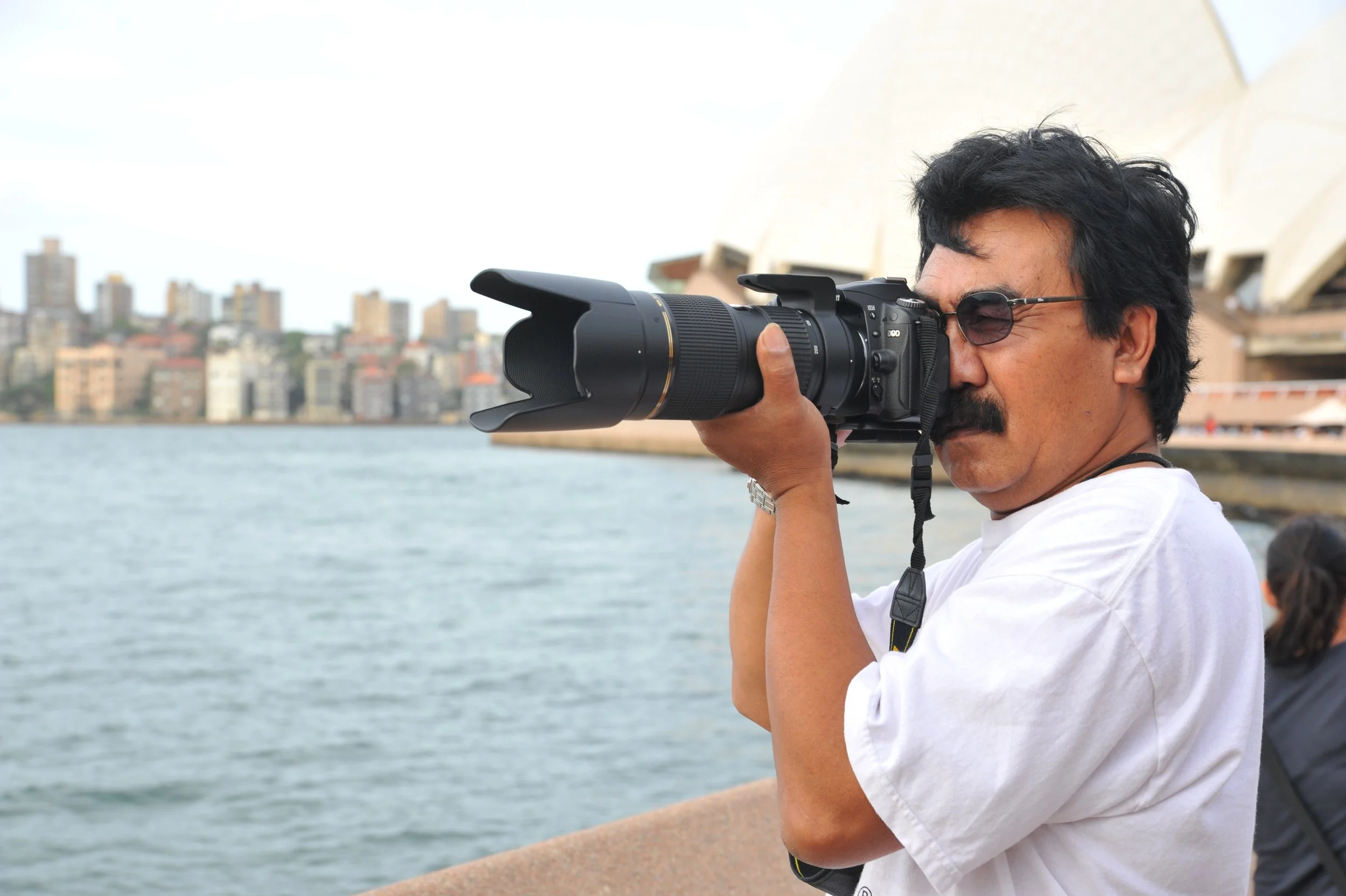 Photography Courses with a student with his Nikon camera at the Sydney Opera House
