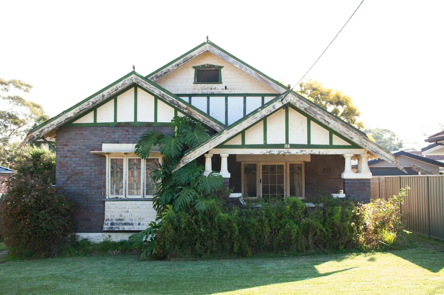 Federation bungalow gables and leafy garden, faded behind the main photo