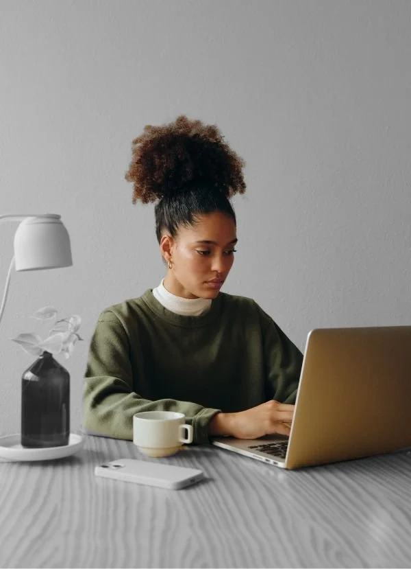 PLEB Group Website Redesign image of a woman on a laptop