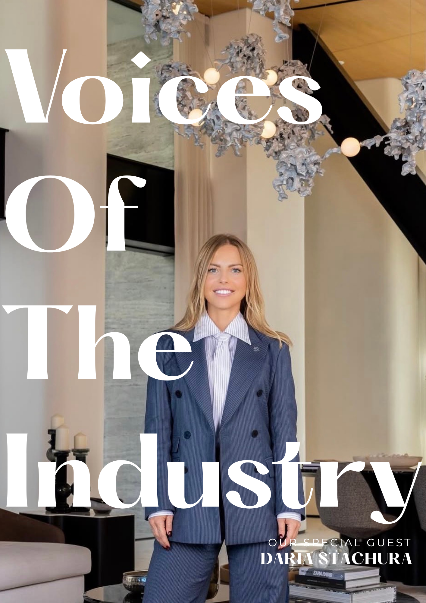 A woman in a blue pinstripe suit standing in a modern living room, with a chandelier and contemporary decor, advertising a podcast titled 'Voices of the Industry' with guest Daria Stachura.