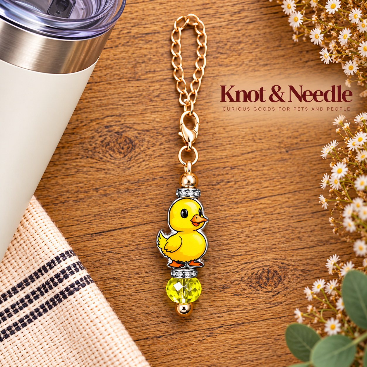 Golden Duck Charm on Rustic Wood.png