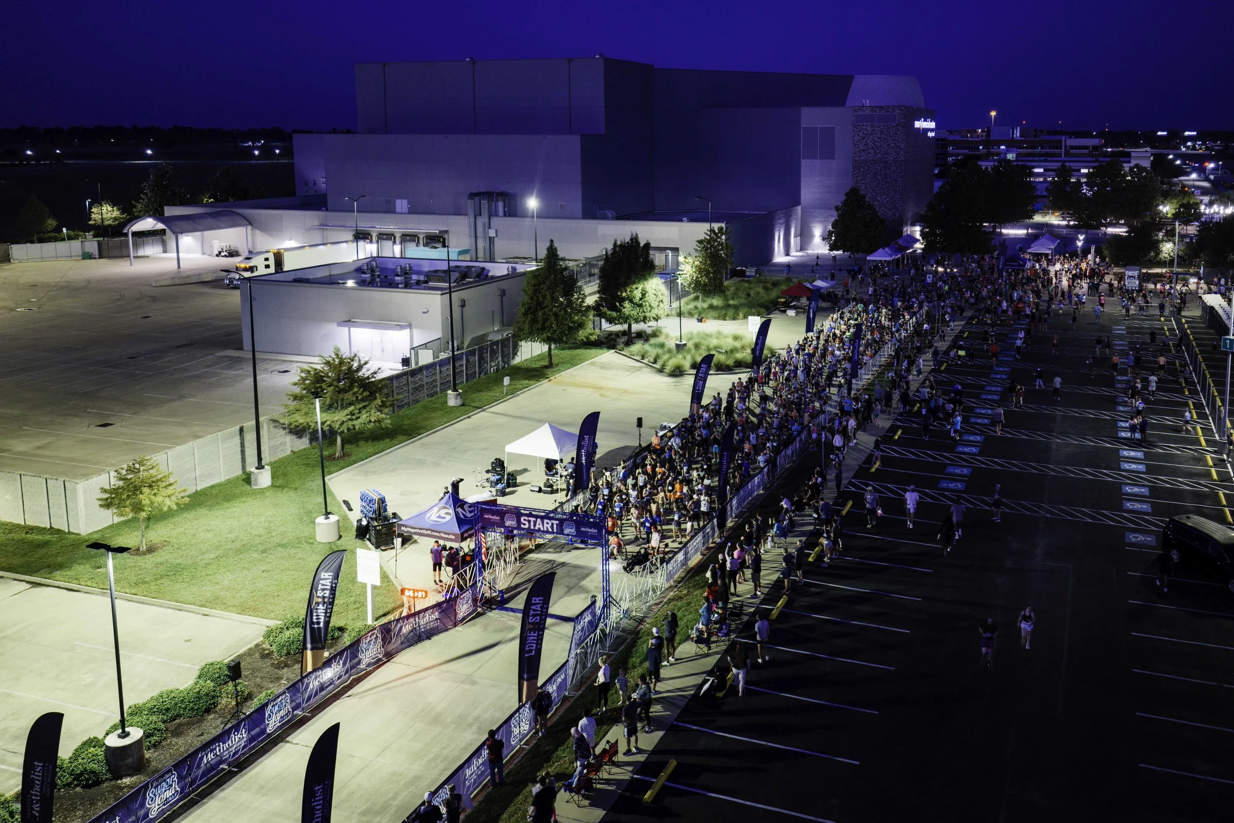 Illuminated Sugar Land start area before sunrise