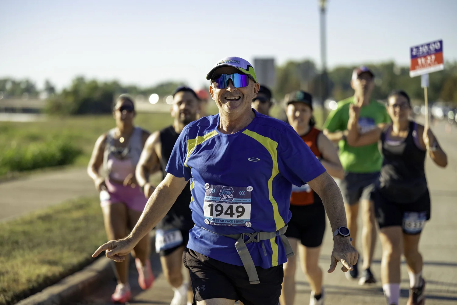 Adult Sugar Land finishers celebrating after the race