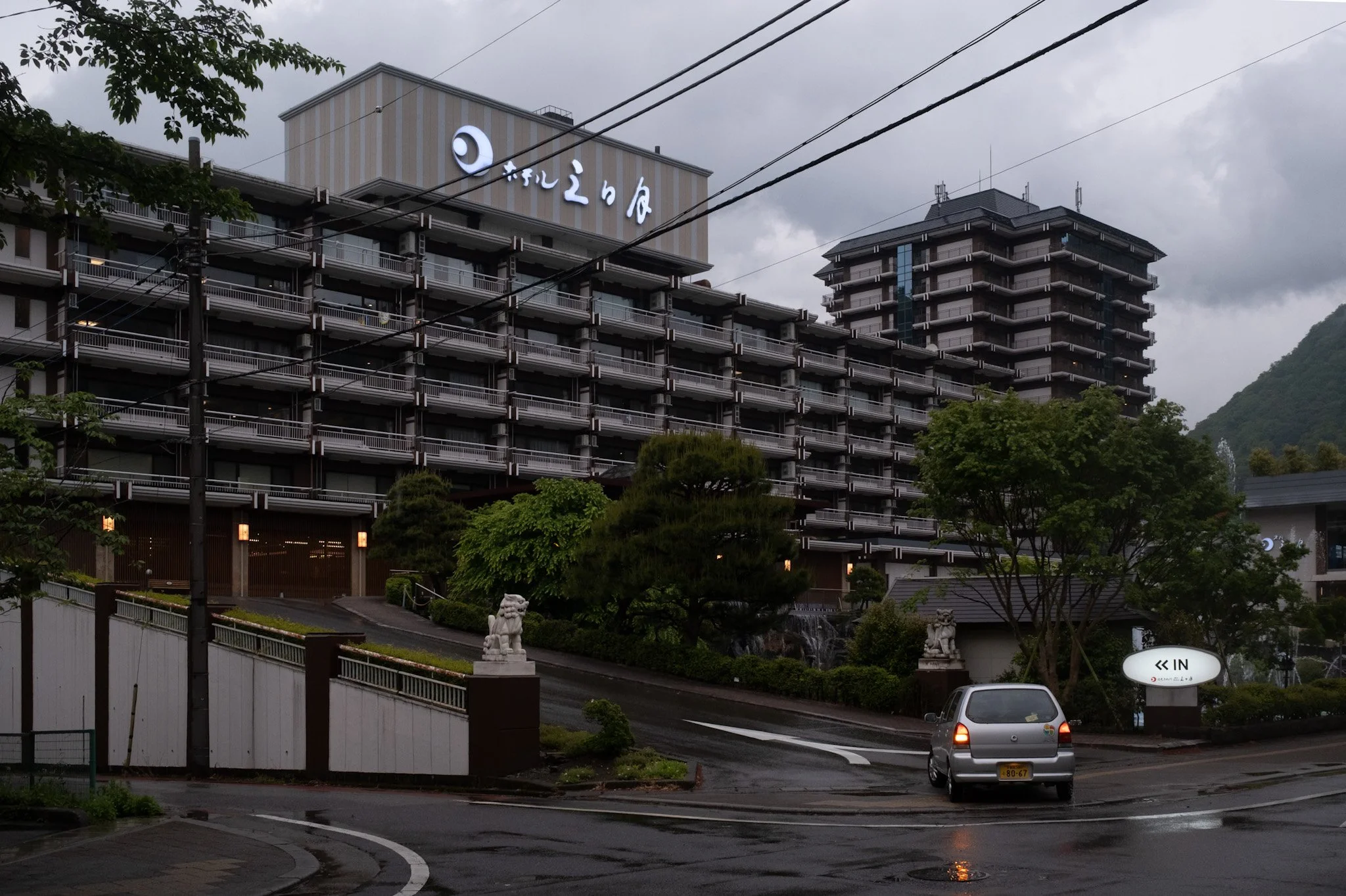 Hotel Mikazuki in Kinugawa Onsen, large operating hotel complex, beneath an overcast sky.