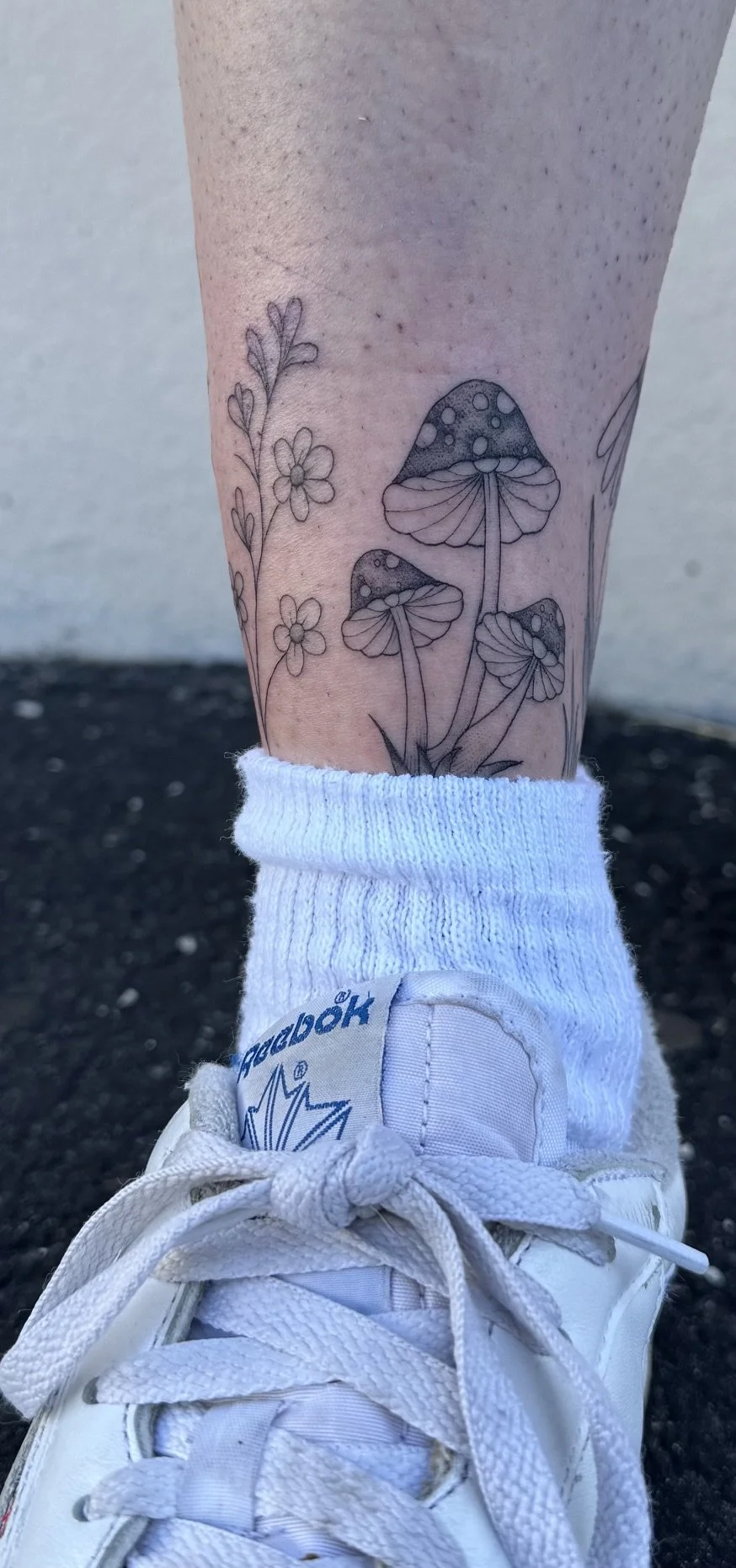 Delicate Fine Line Mushroom Tattoo on Ankle by Madison Paige Davenport at Handsome Devil Tattoo in Saddle Brook, NJ, Bergen County