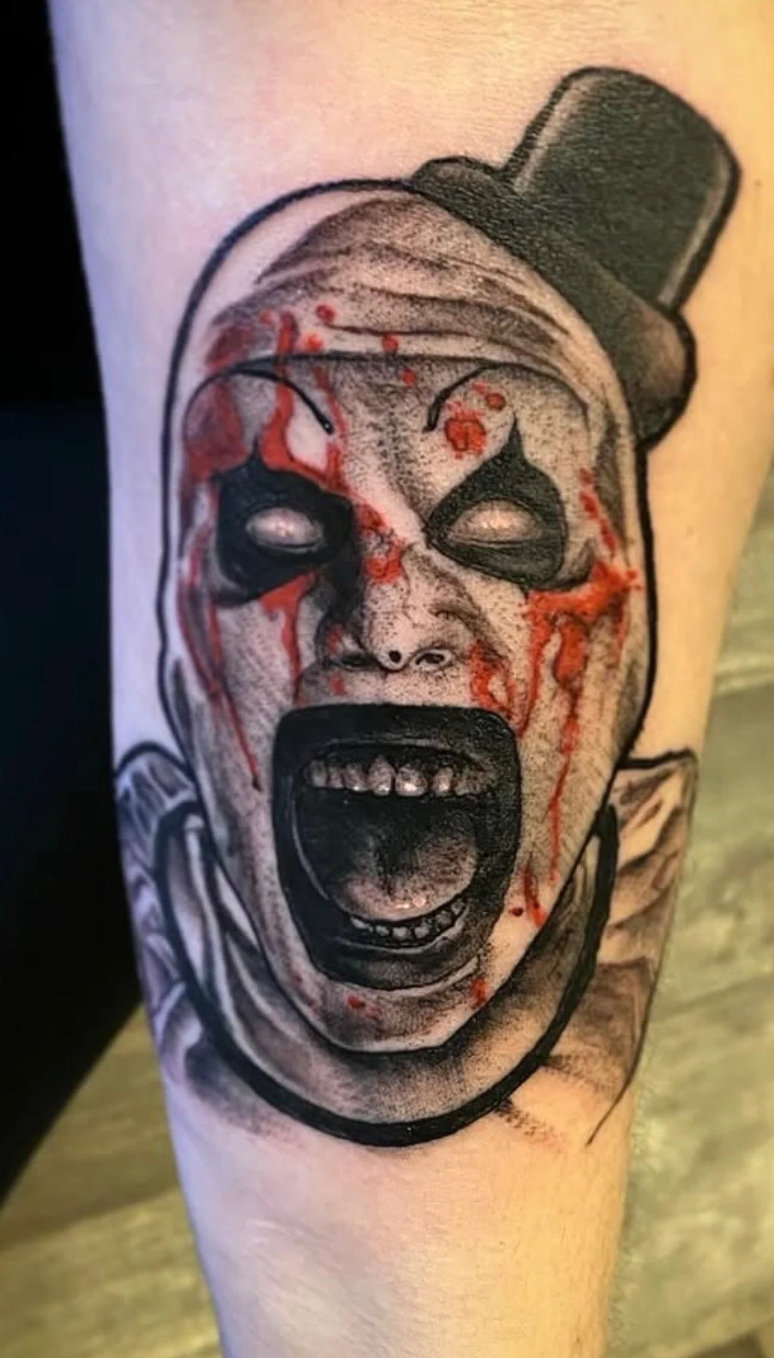 Black and Grey Art The Clown Horror Movie Tattoo by Russell Kelley at Handsome Devil Tattoo Company in Saddle Brook, NJ.